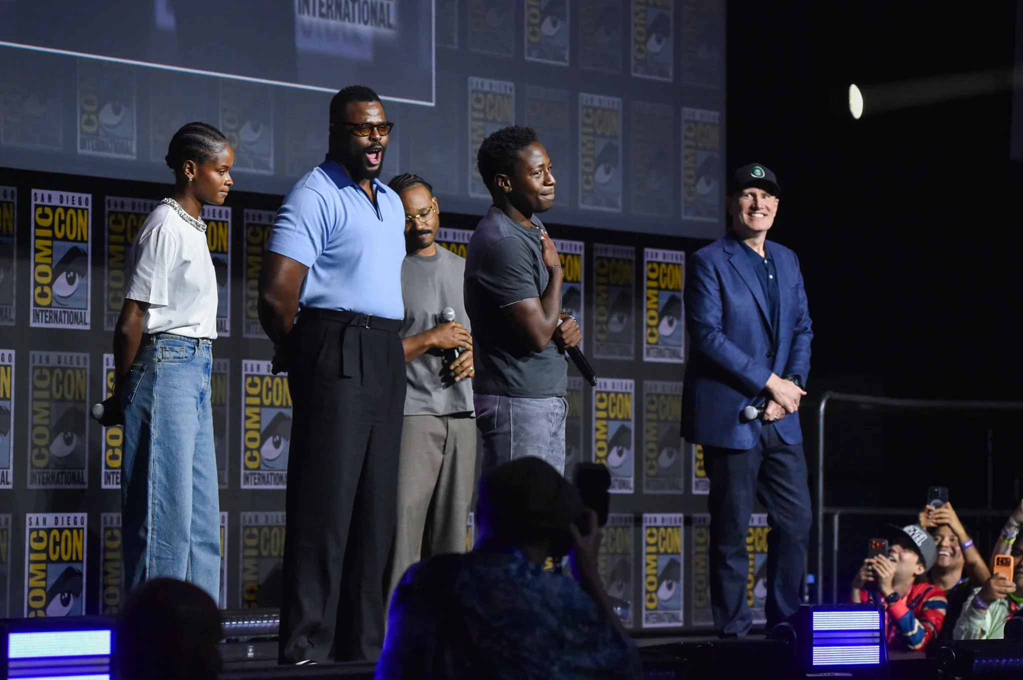 David Jonsson onstage with Letitia Wright, Winston Duke, Ryan Coogler, and Kevin Feige at San Diego Comic-Con 2026.