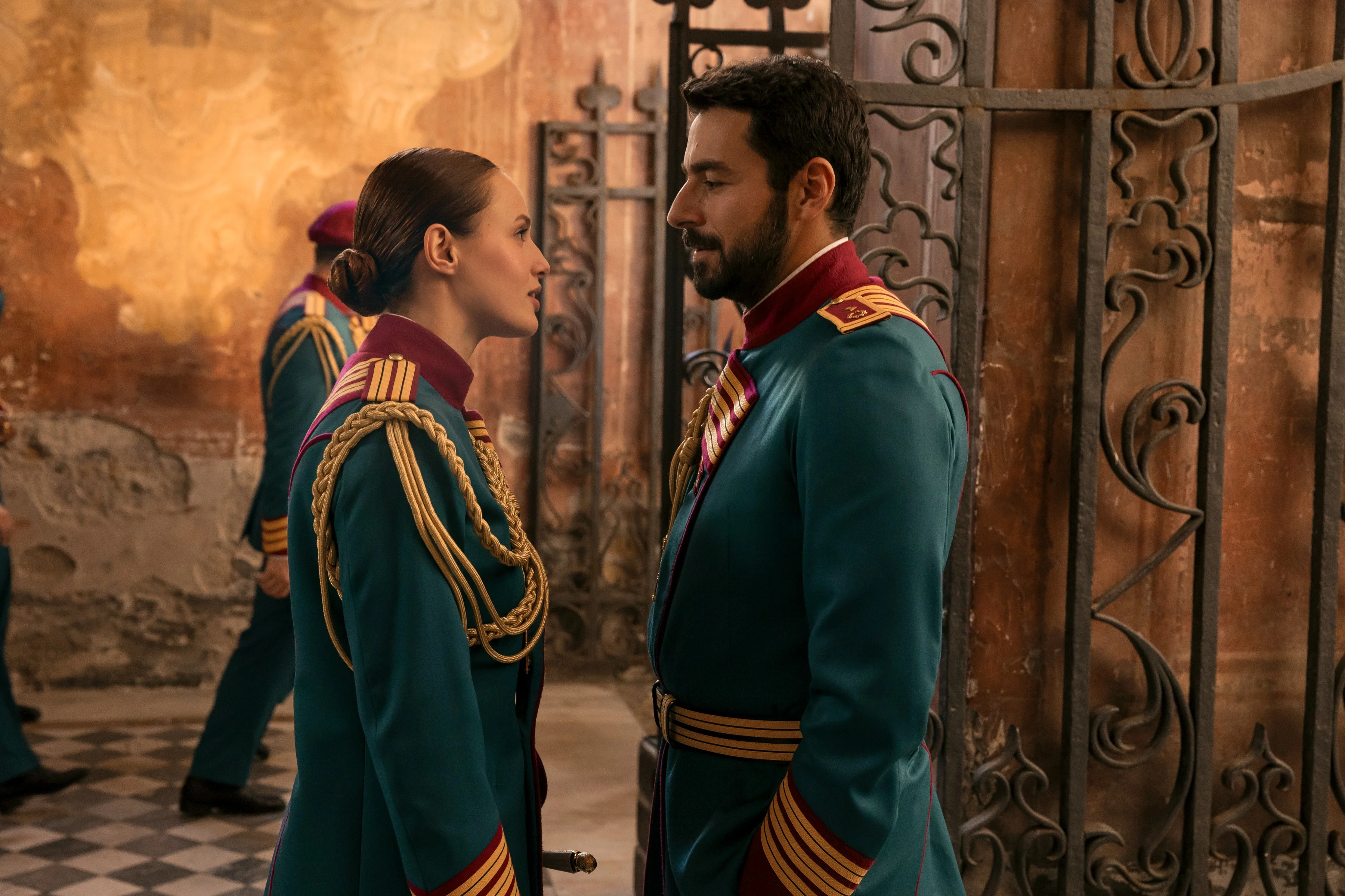 Two uniformed cadets face each other in an official Minerva Academy still.
