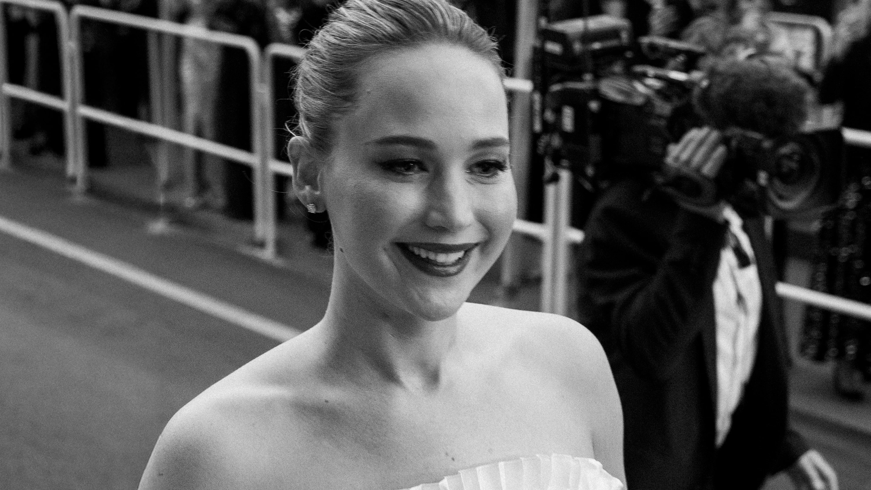 Jennifer Lawrence smiles on the Cannes Film Festival red carpet in 2025.