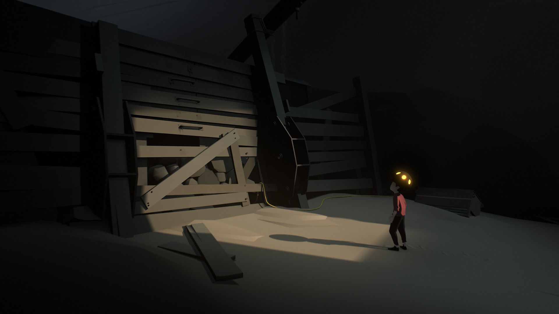 The boy carries a glowing object toward a boarded structure.