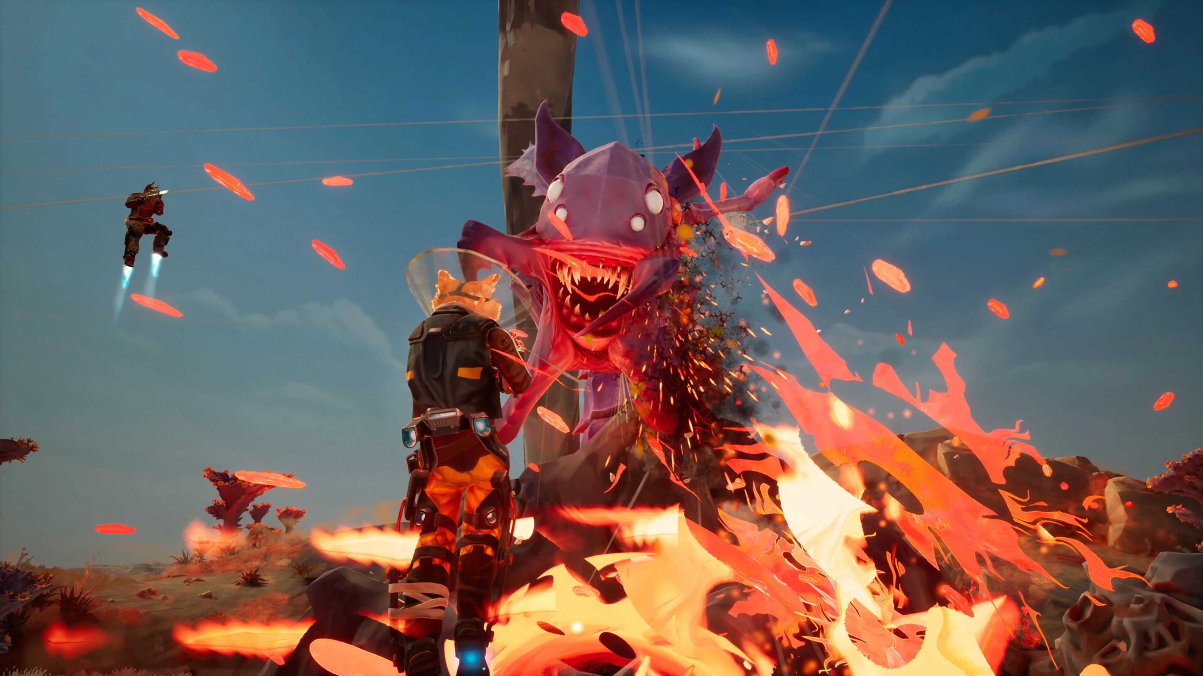 Two Gravhounds fire at a large red alien while a teammate boosts through the air.