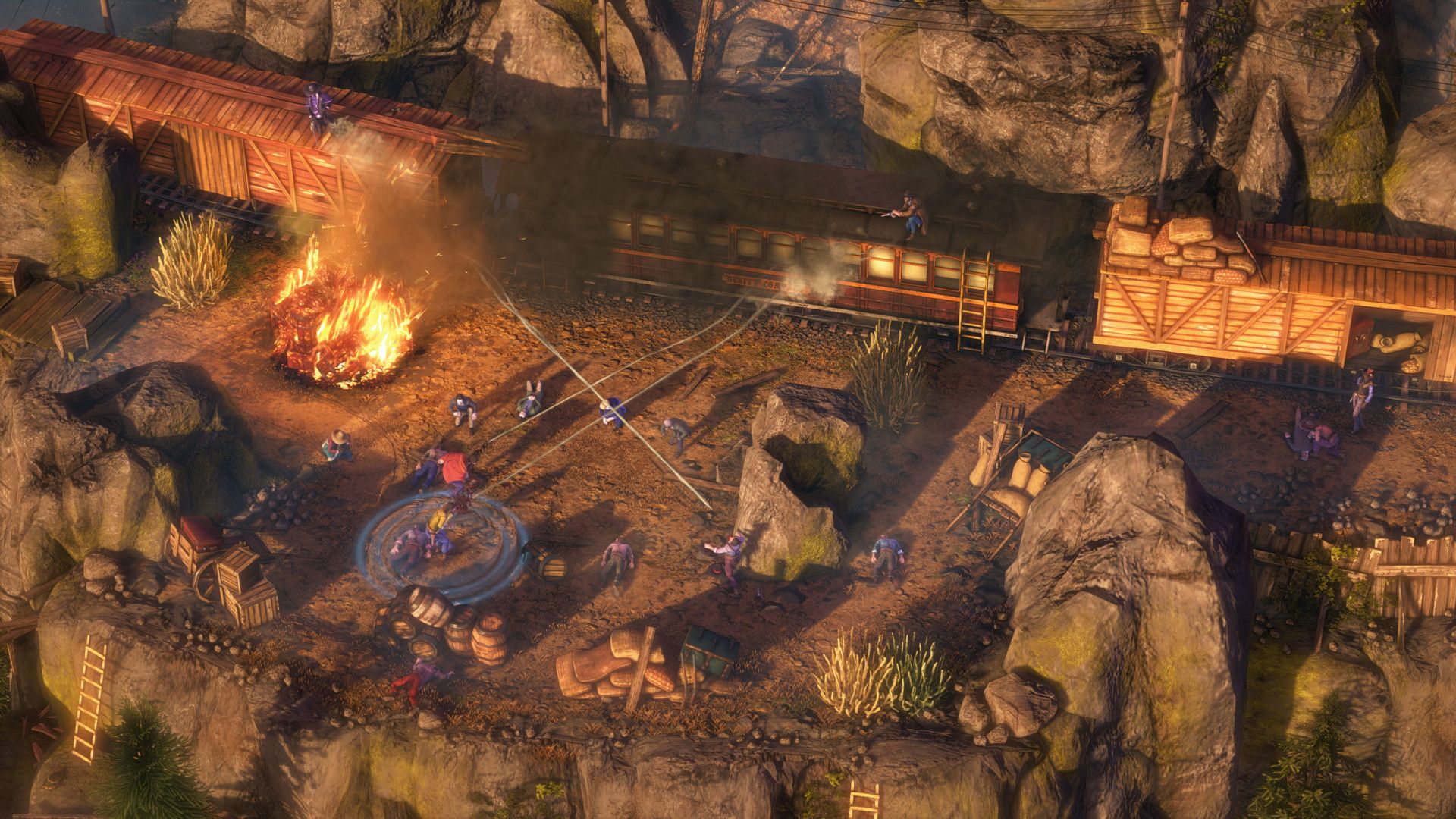 A train moves past a campfire and canyon rocks, showing the Wild West setting and characters viewed from above.