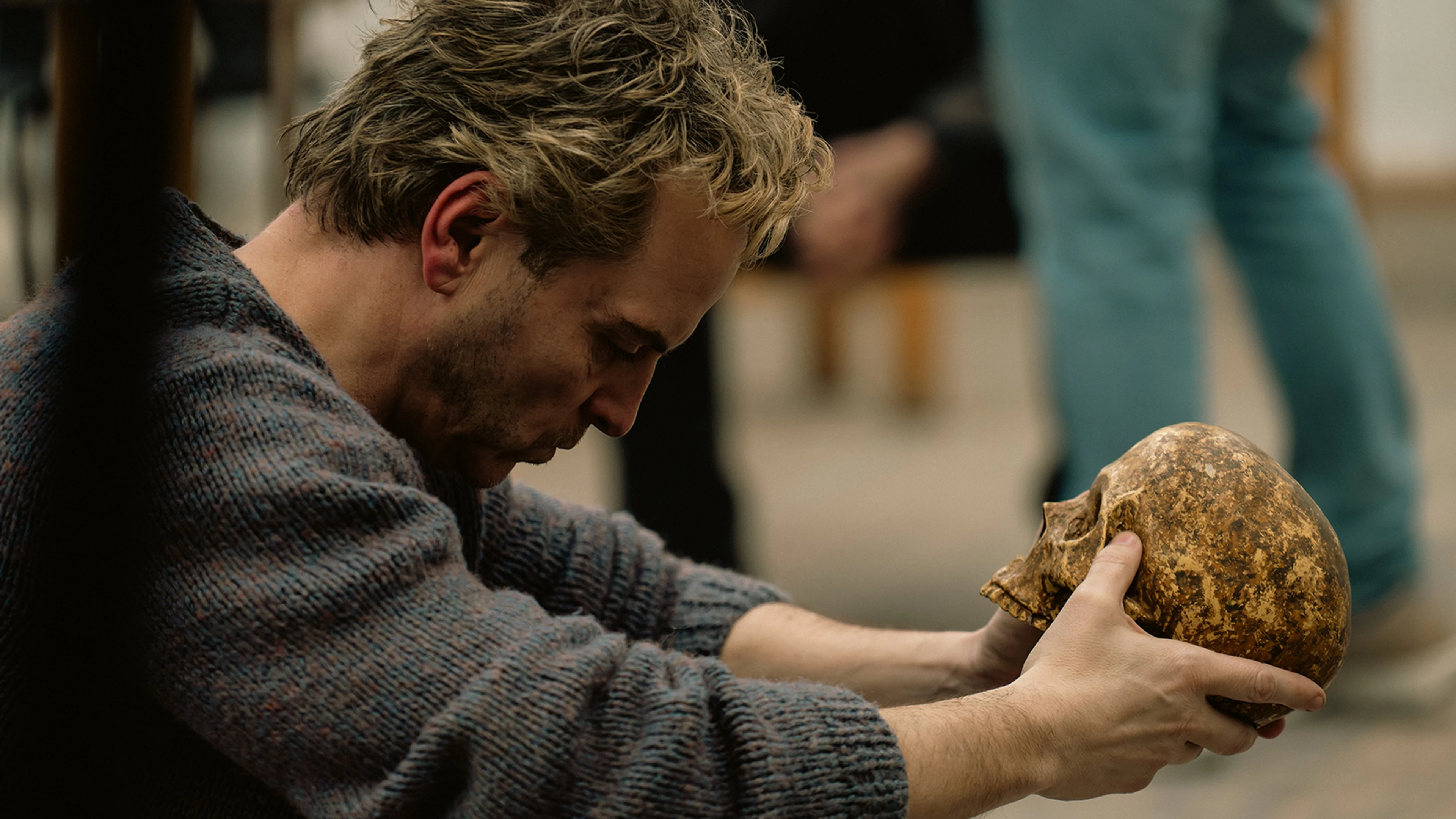Andrew Scott as Ian Charleson holds a skull in the official Elsinore film image.