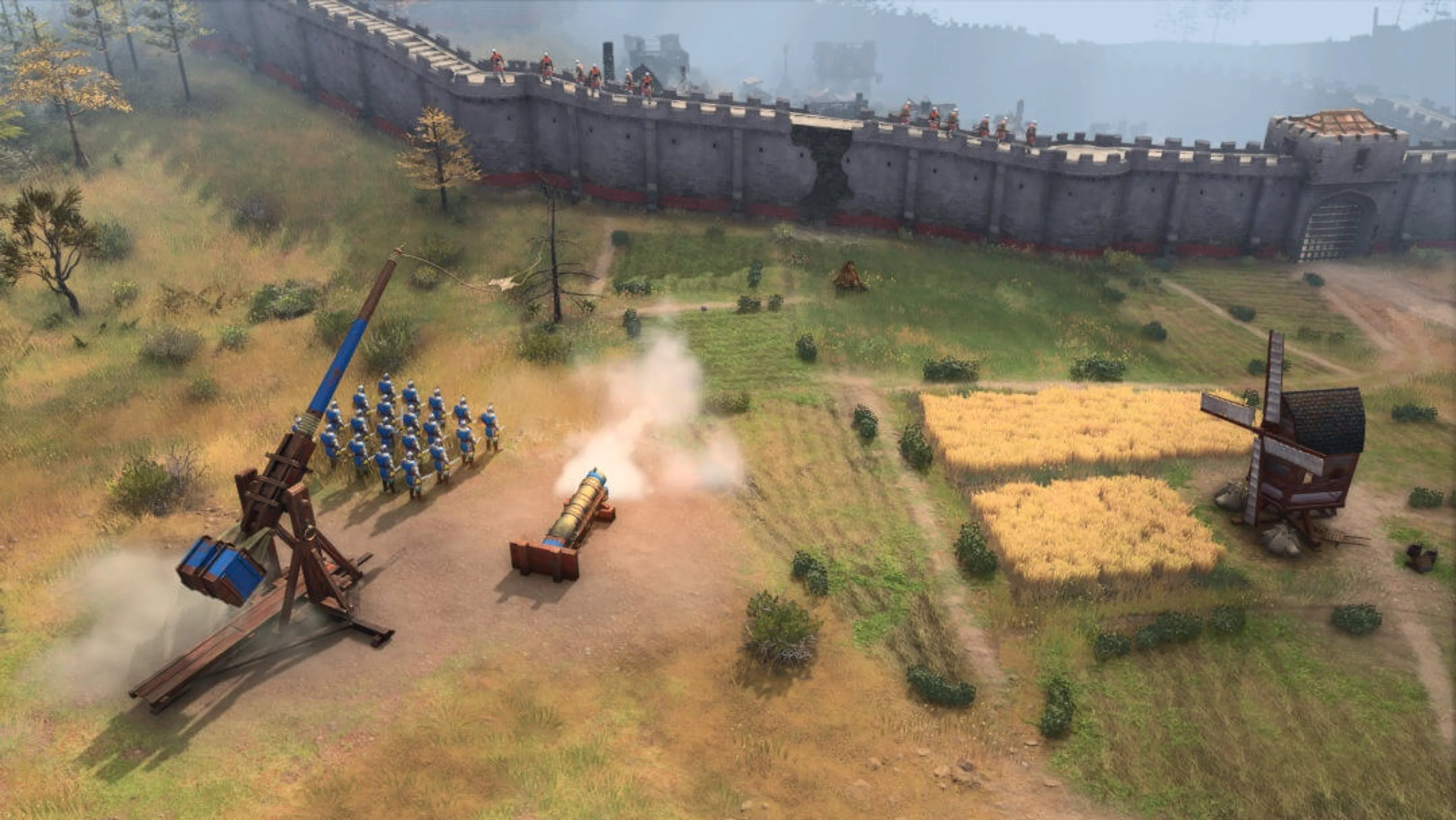 The tall wooden throwing machine on the left is a Trebuchet; the gun beside it is a Bombard. These building attackers need a protecting army and a safe position from which to fire.
