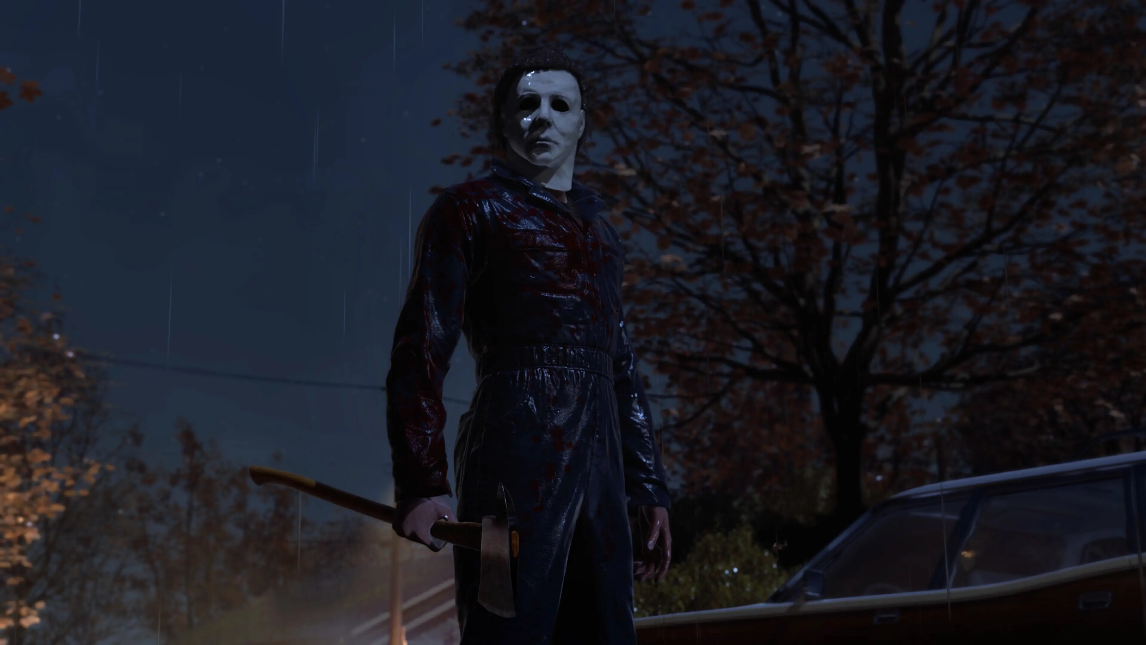 Michael Myers stands in the rain with a bloody axe beside a parked car in Halloween: The Game.