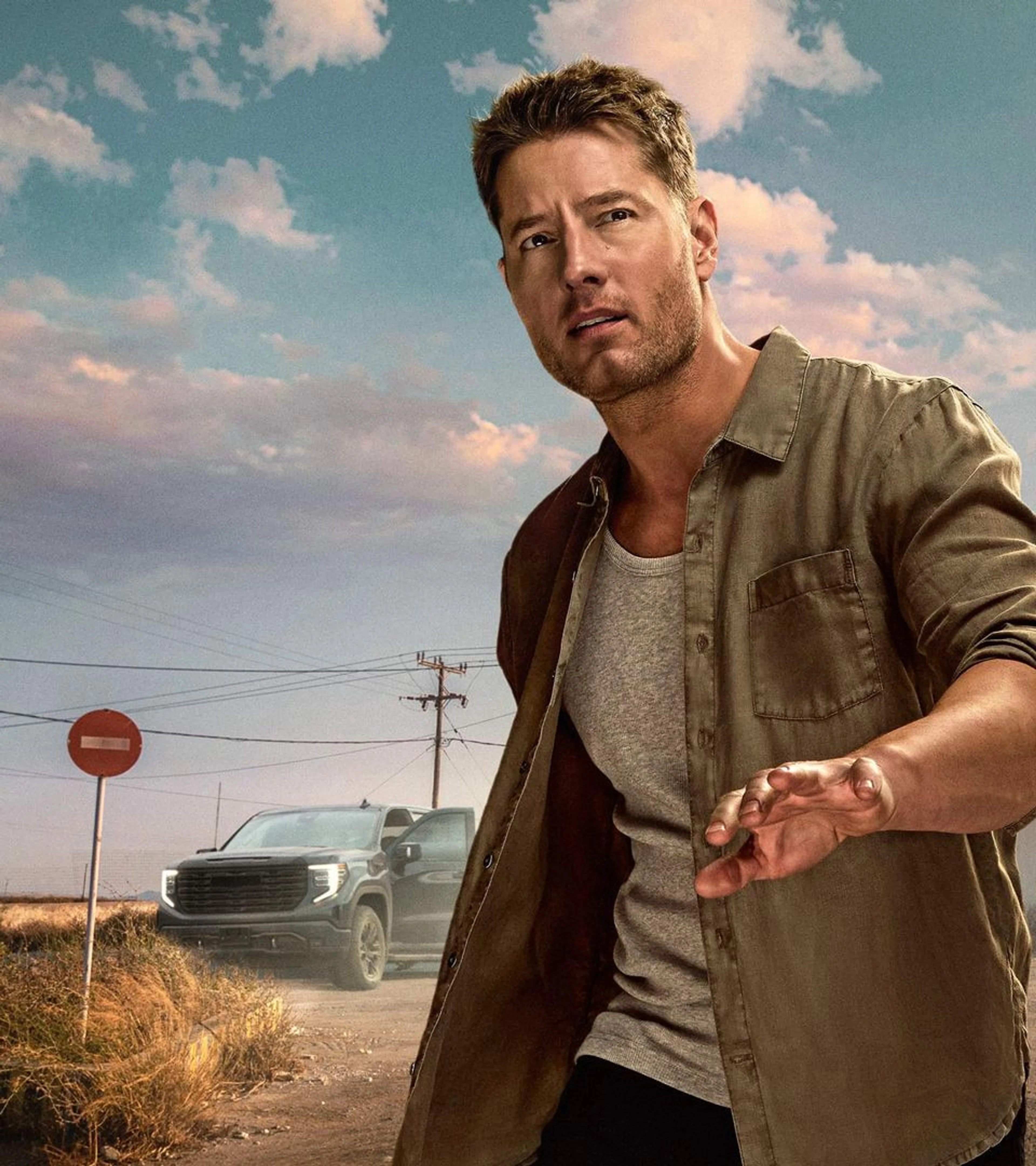 Justin Hartley stands beside a truck in official Tracker artwork.