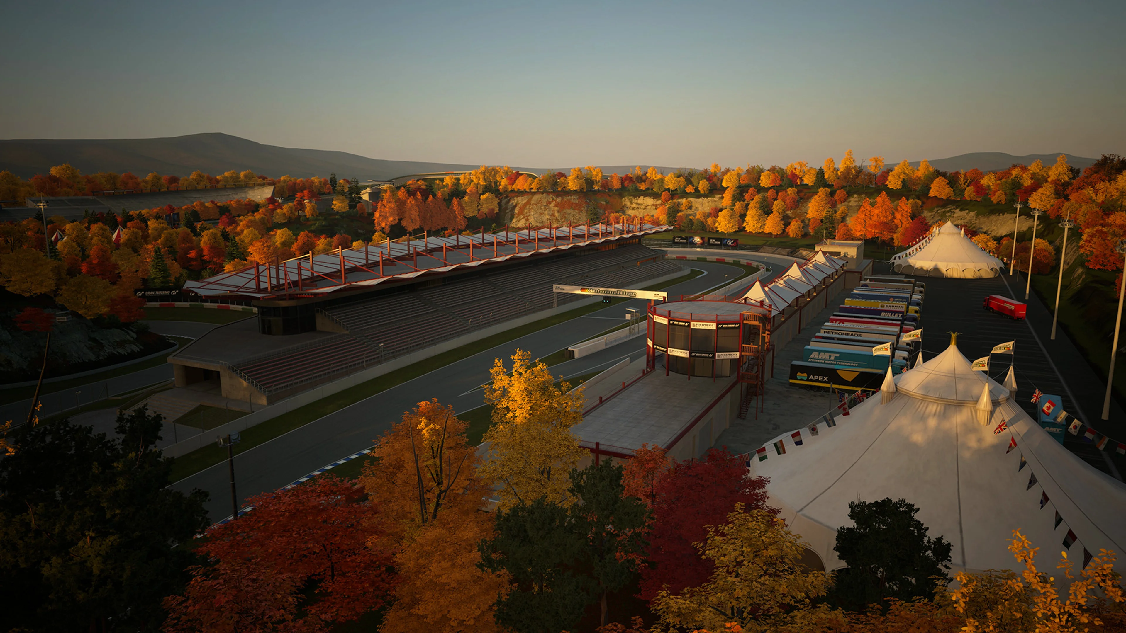 Autumn Ring winds through orange trees in Gran Turismo 7 Spec IV.