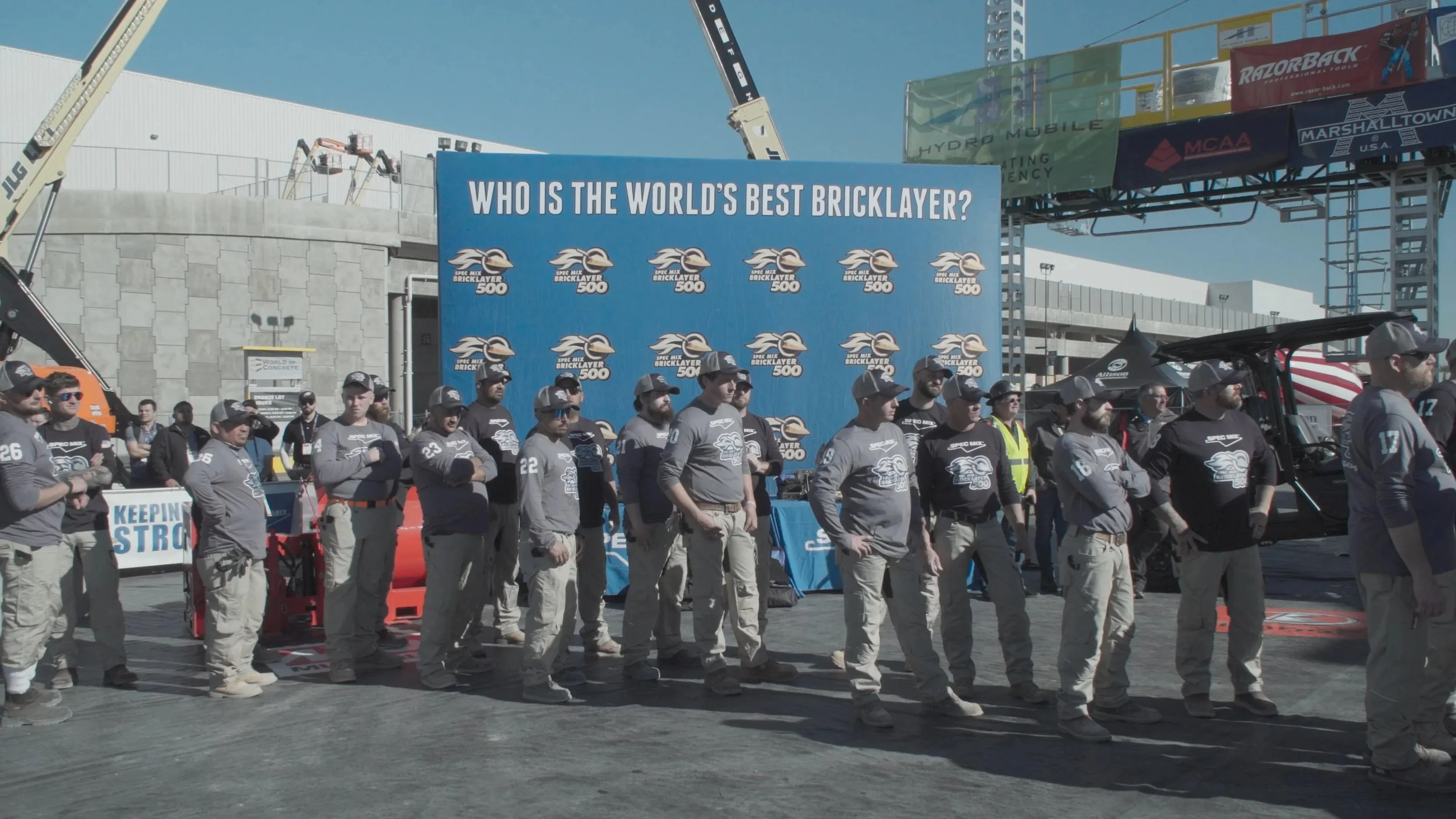 A group gathers at a bricklaying competition.