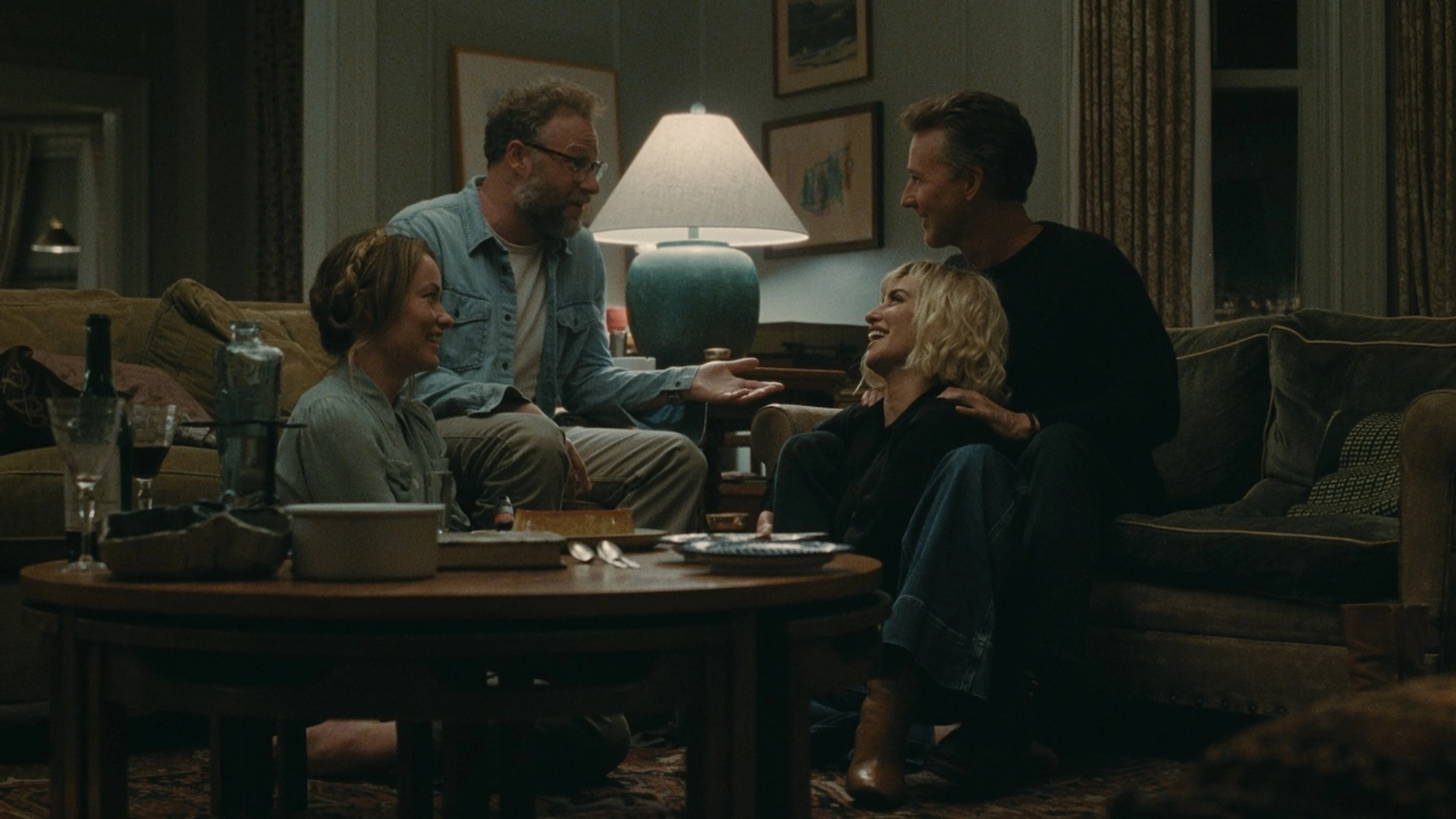 Joe and Angela sit with Hawk and Piña in their living room.