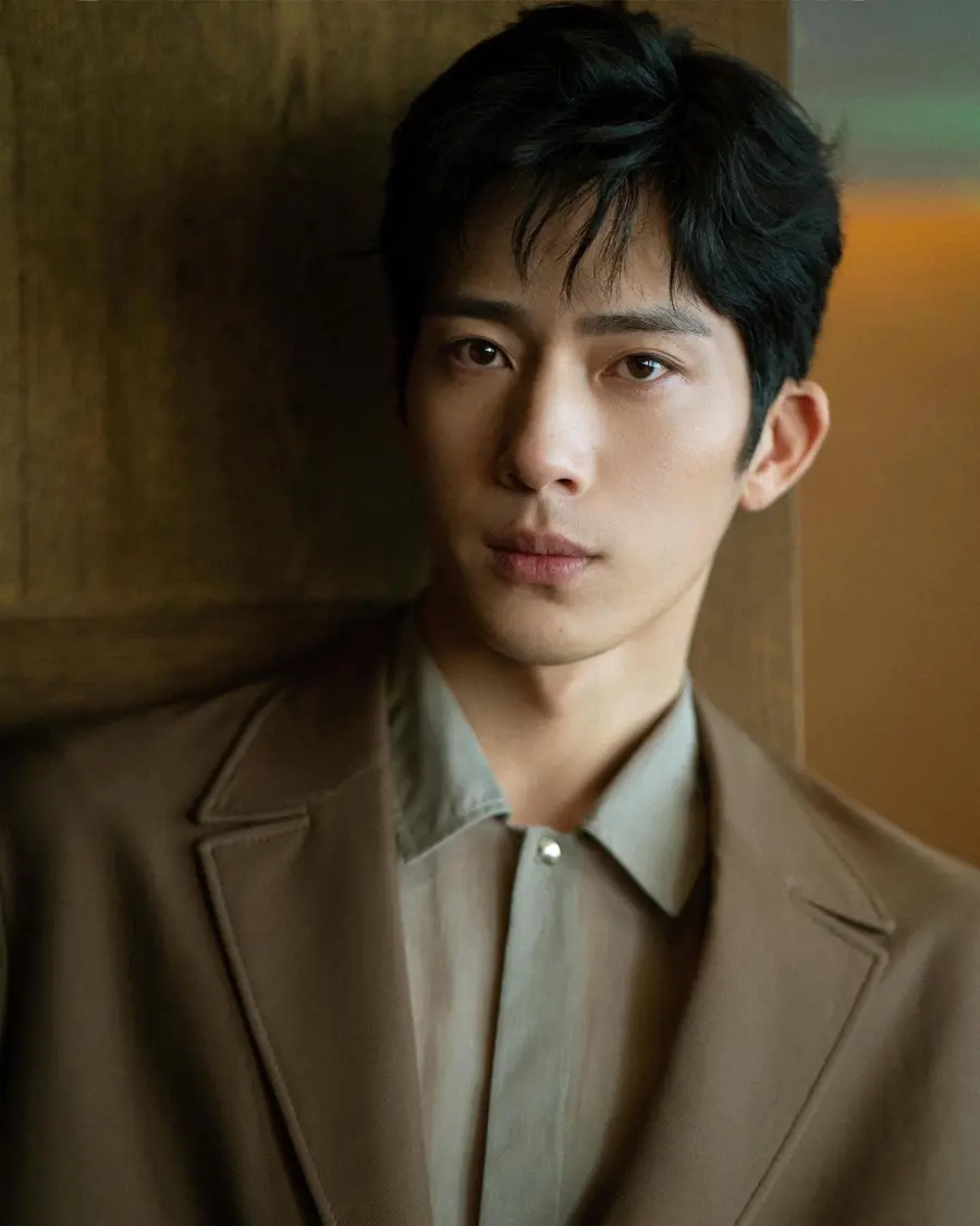 Jing Boran in a brown suit in his Marie Claire China portrait.