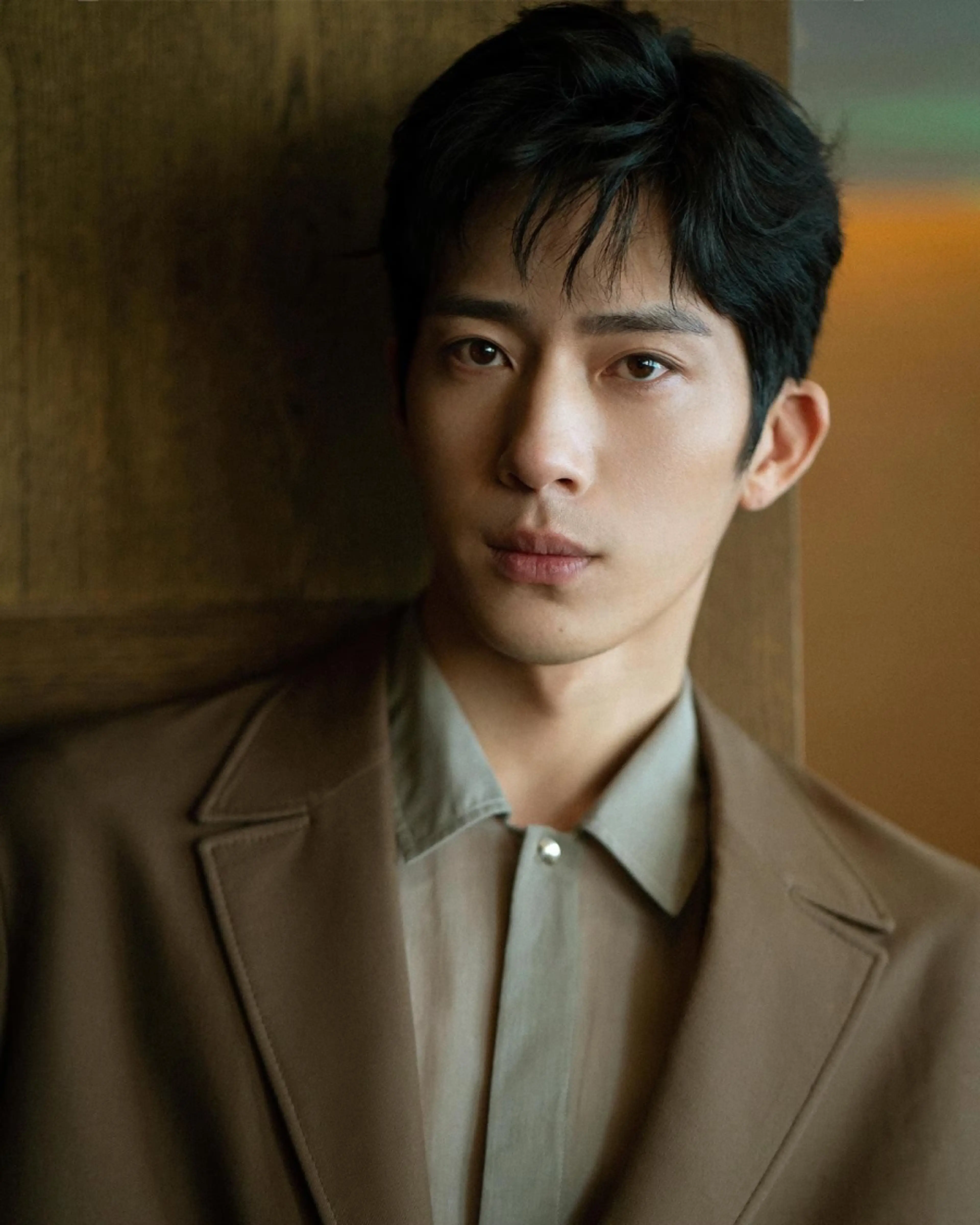 Jing Boran in a brown suit in his Marie Claire China portrait.