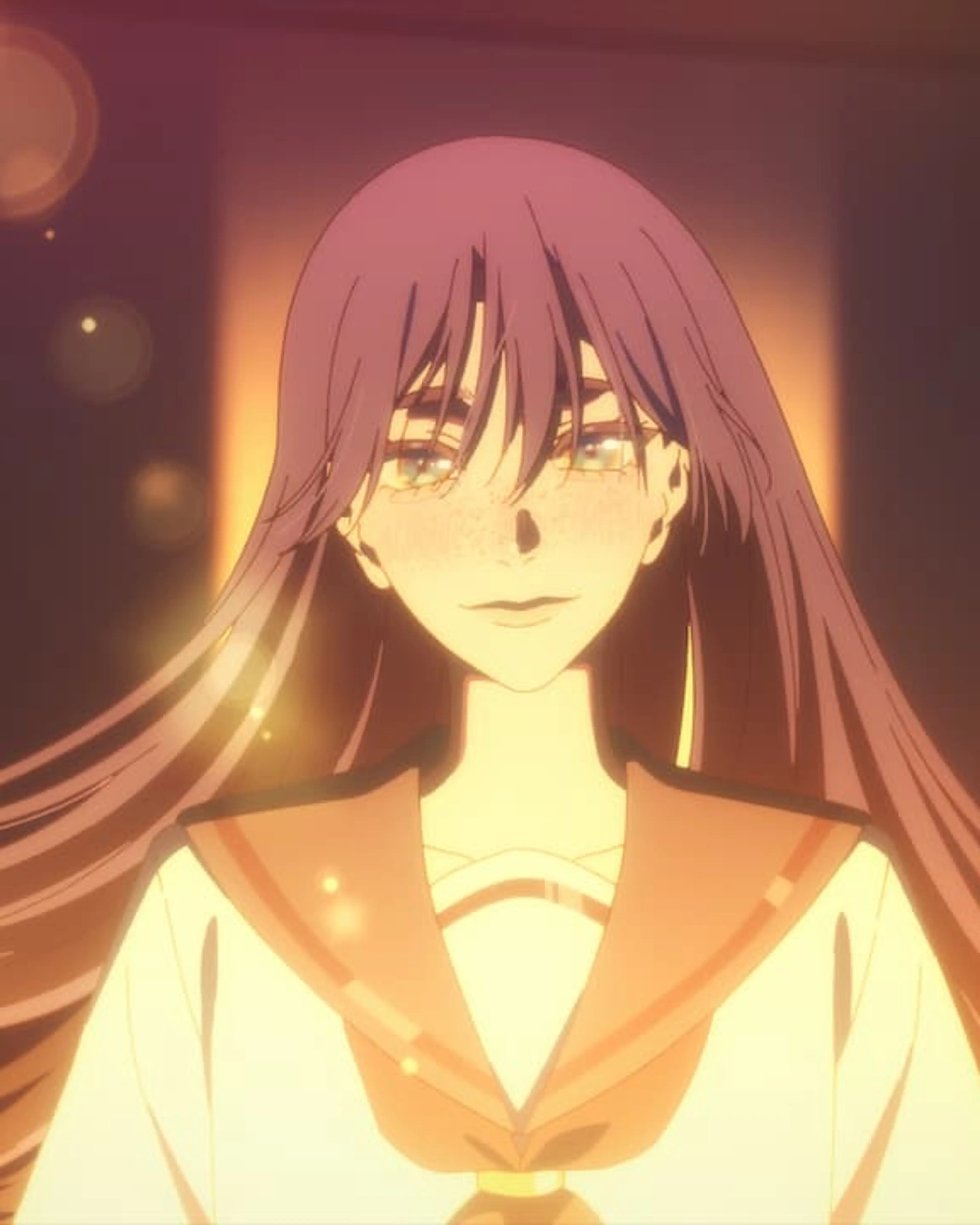 Jun’s long hair and freckles are visible in a warm-lit BLESS scene.