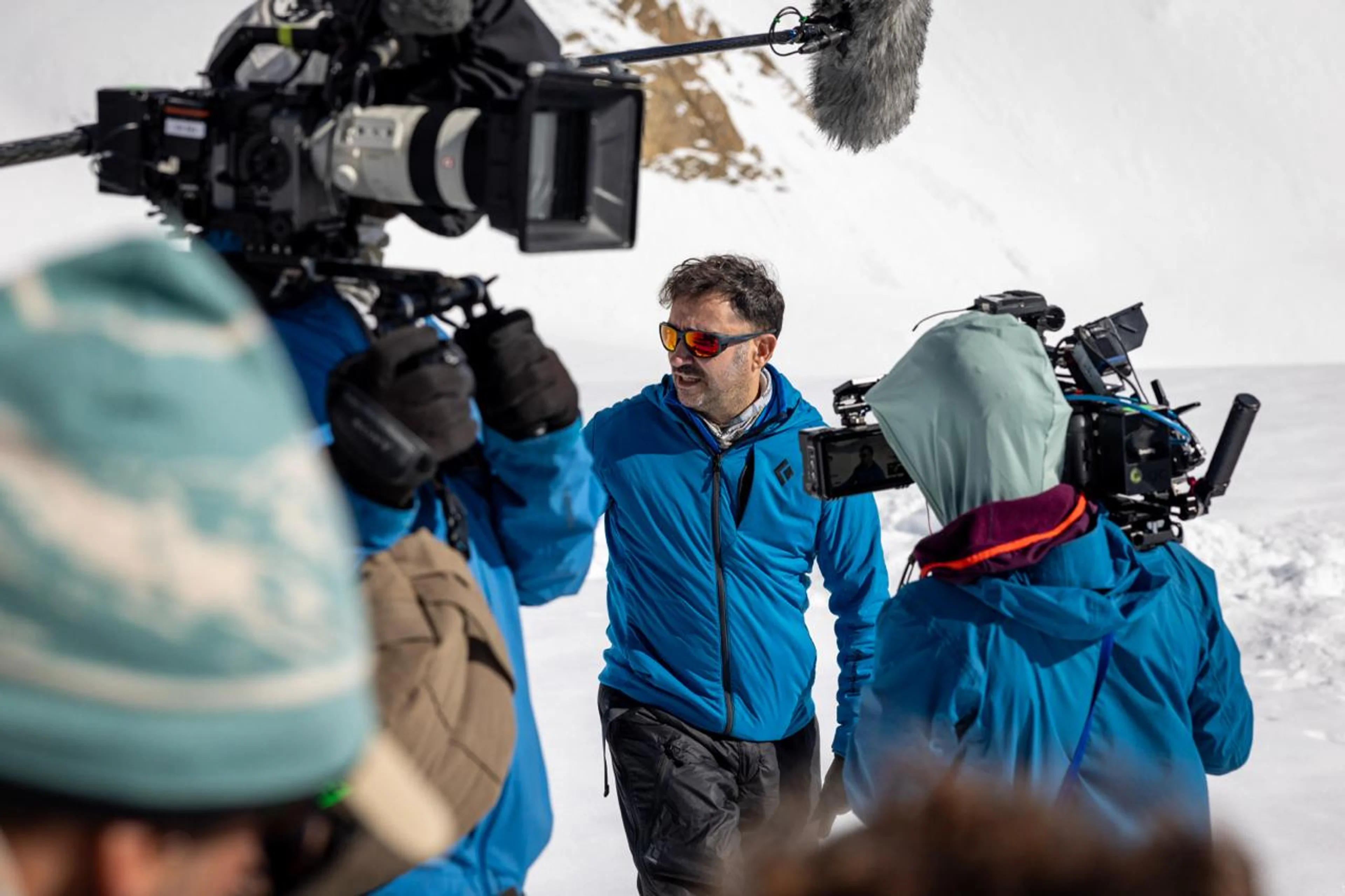 A documentary crew films in deep snow in the Andes for Beyond Society.