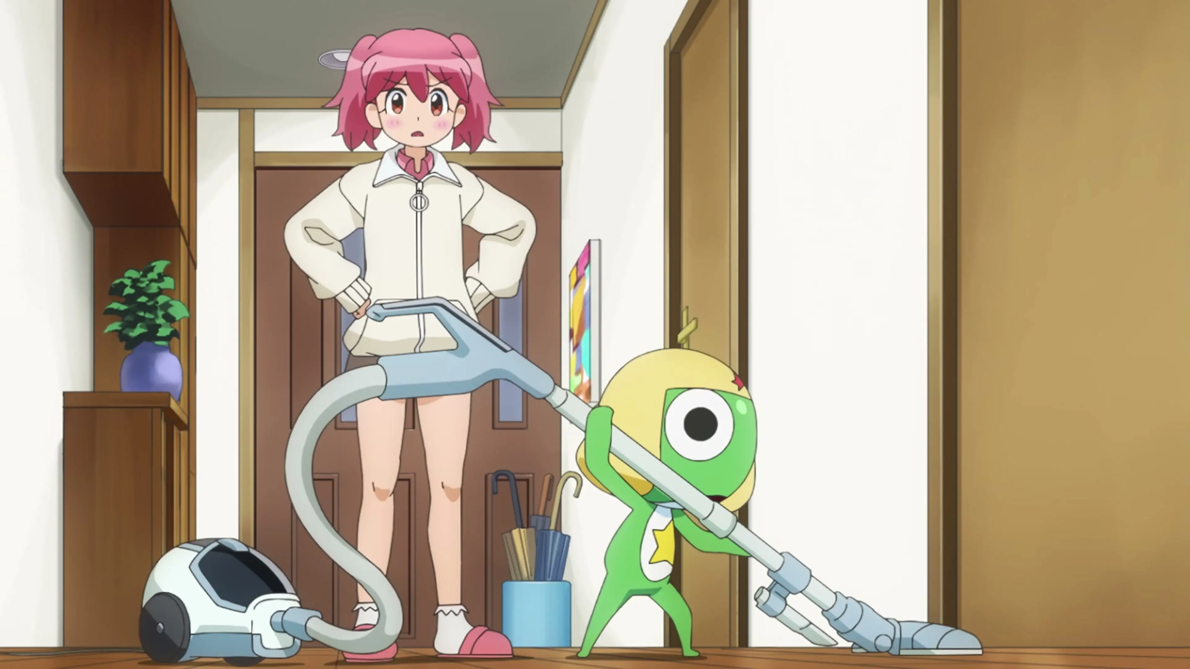 Keroro confidently vacuums the Hinata home while Natsumi watches from the hallway in the new Sgt. Frog anime trailer.