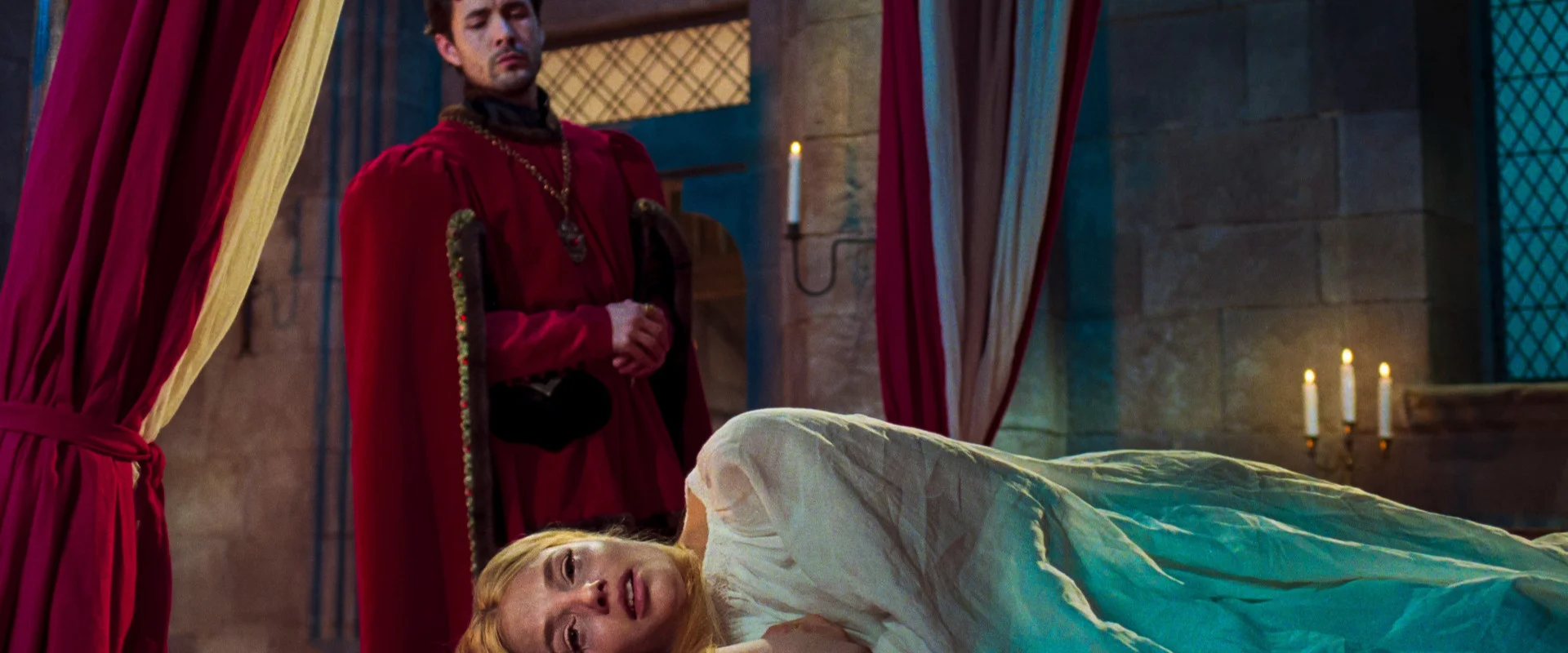 A woman lies in an ornate bedroom in the medieval ghost story The Face of Horror.