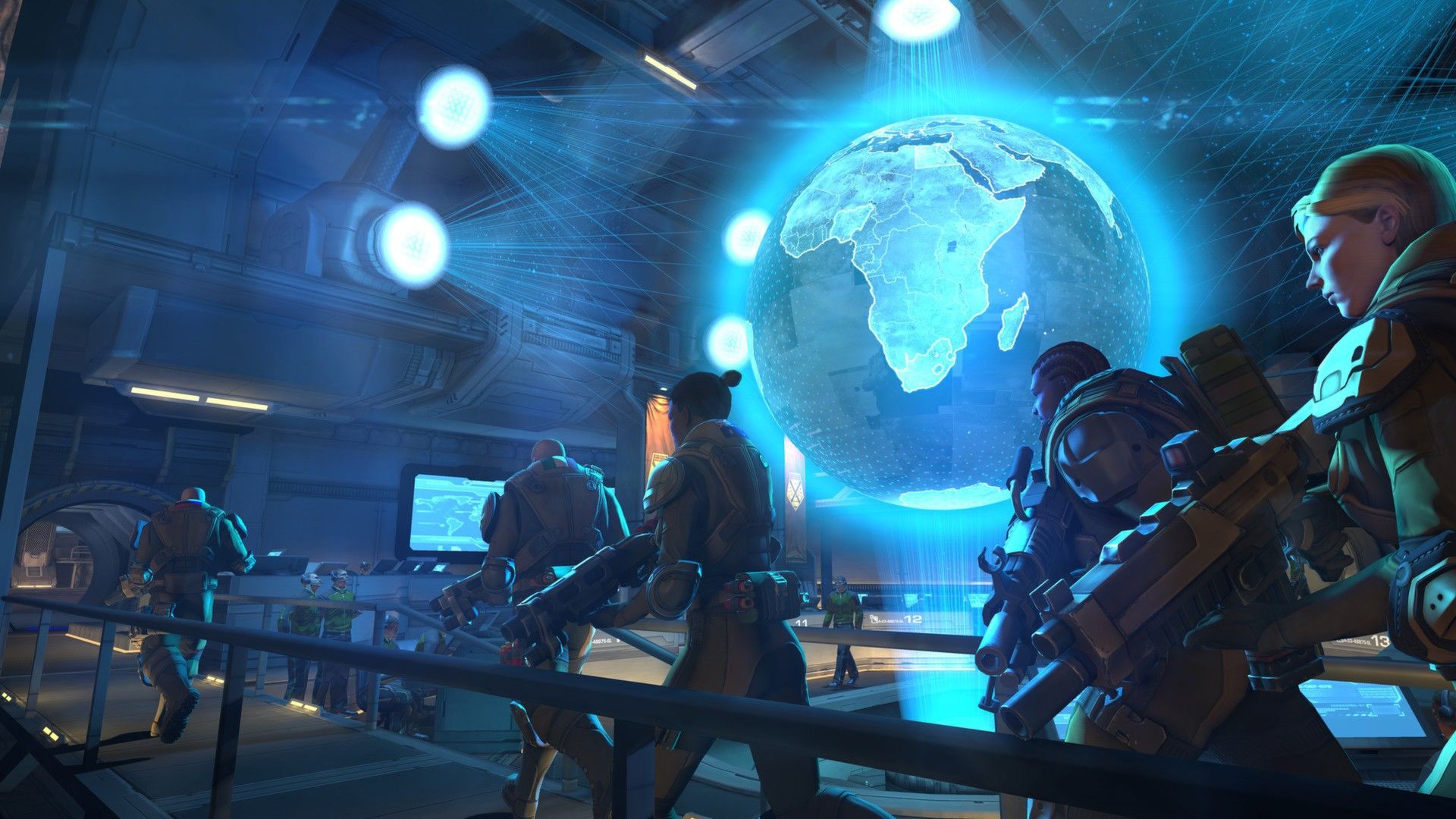 XCOM personnel gather around a glowing globe inside the base.