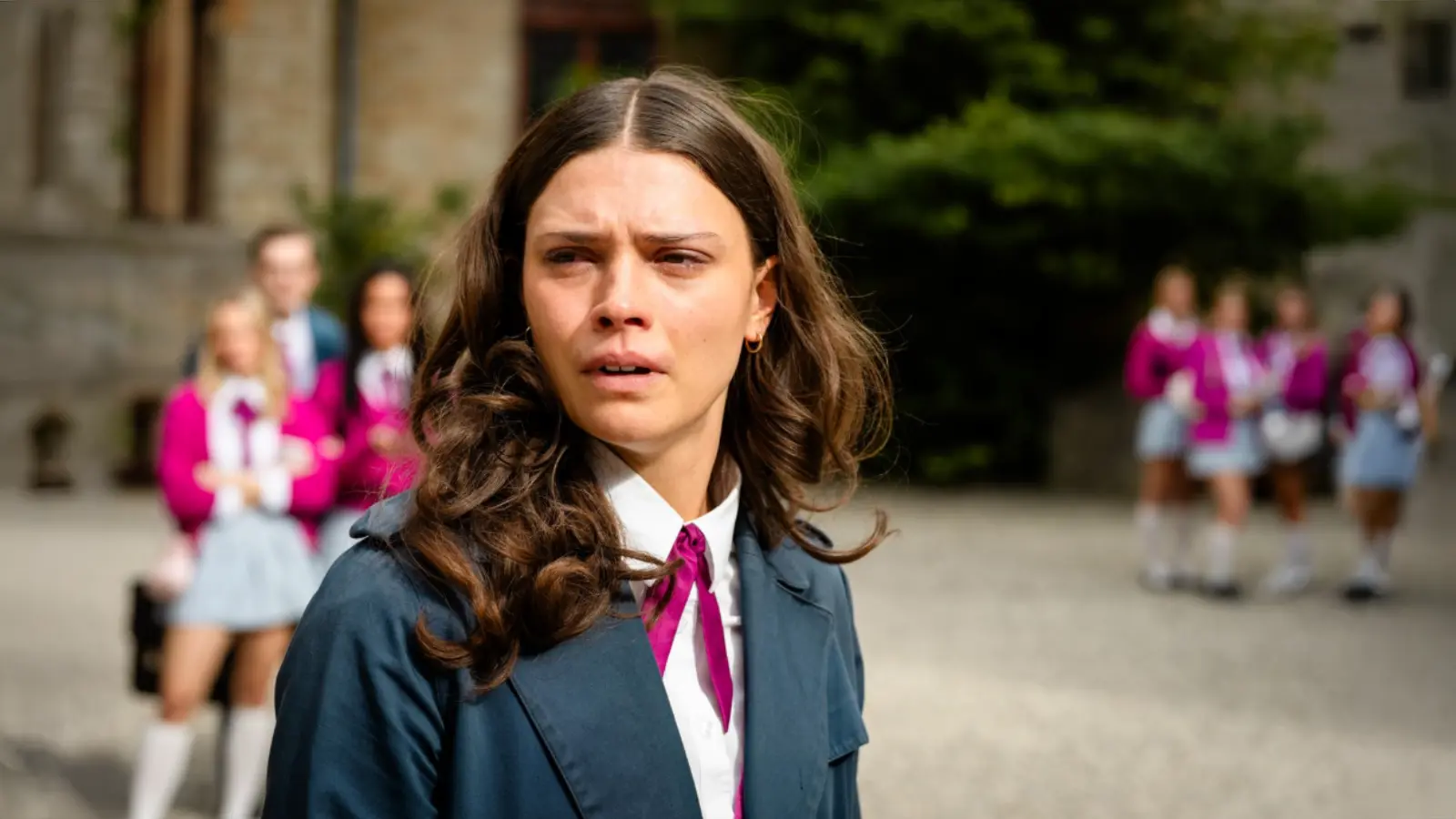 Harriet Herbig-Matten as Ruby Bell looks upset in the Maxton Hall courtyard in Season 3.