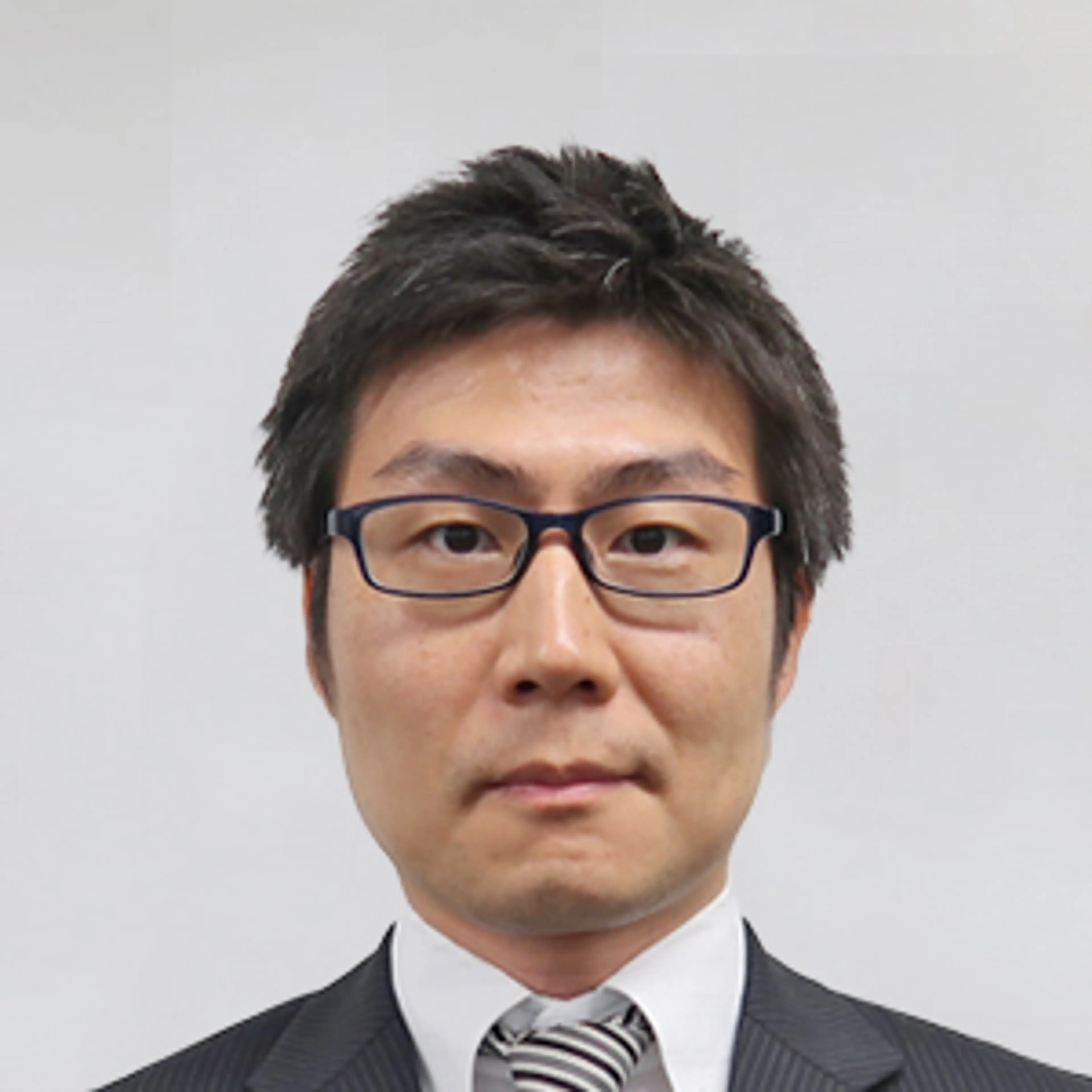 Nippon Ichi Software executive Kenzo Saruhashi poses for an official portrait.
