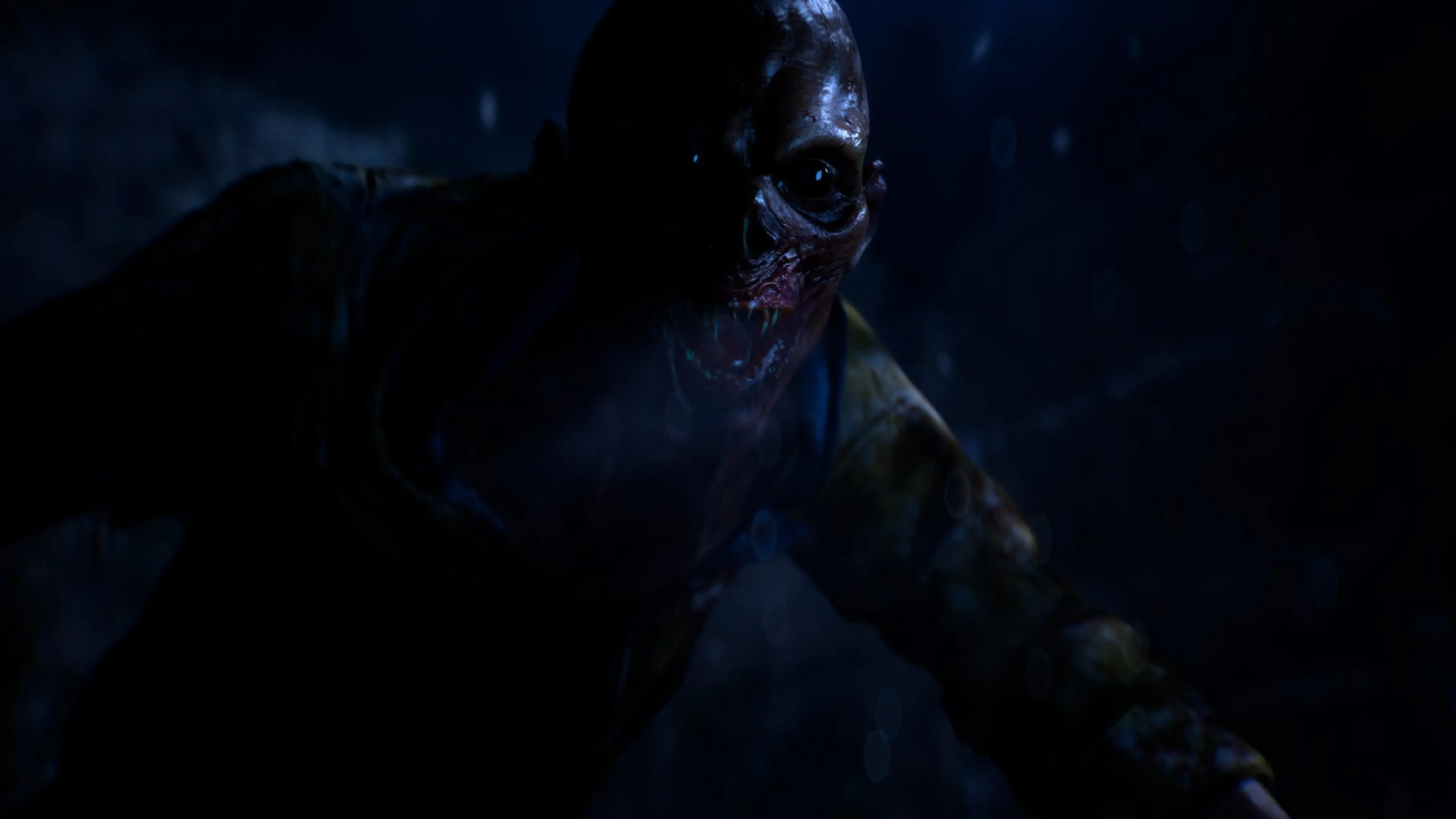 A grotesque creature emerges through heavy rain in Until Dawn 2.
