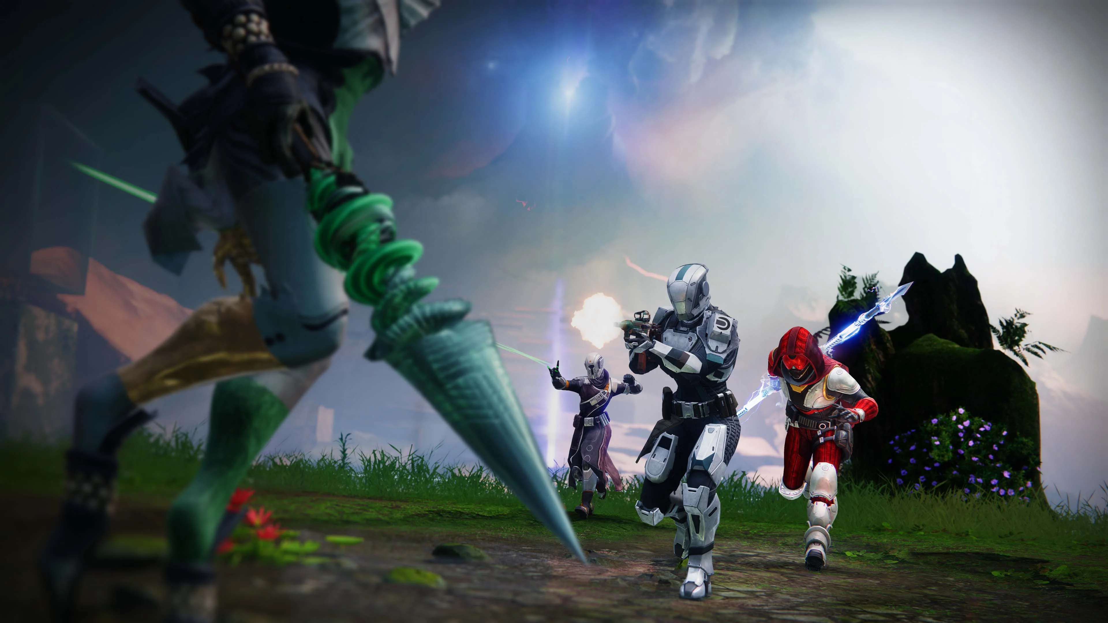 Three Destiny Guardians in anniversary armor charging into combat.