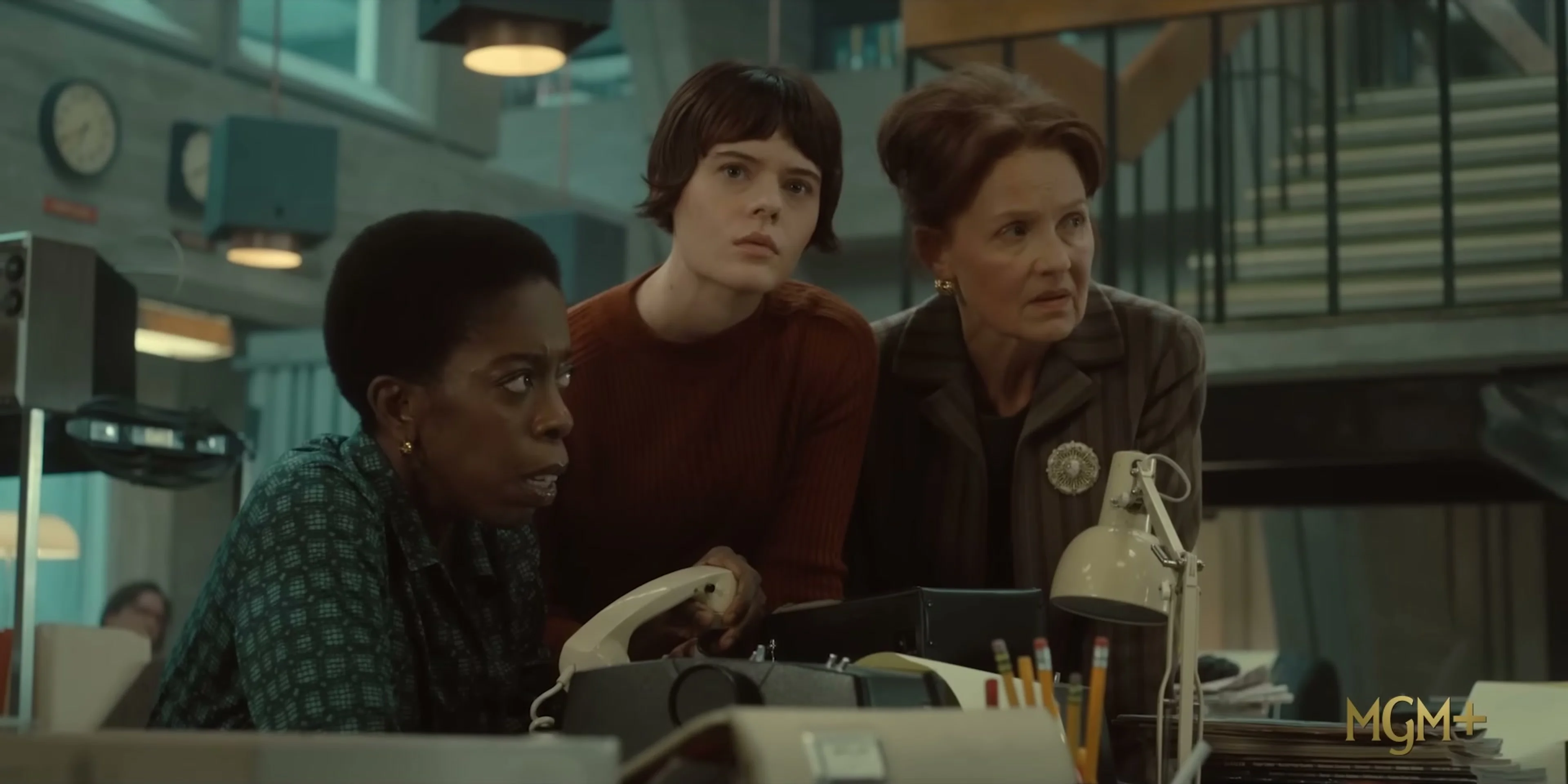 Four women watch a crisis unfold inside the American Hostage newsroom.
