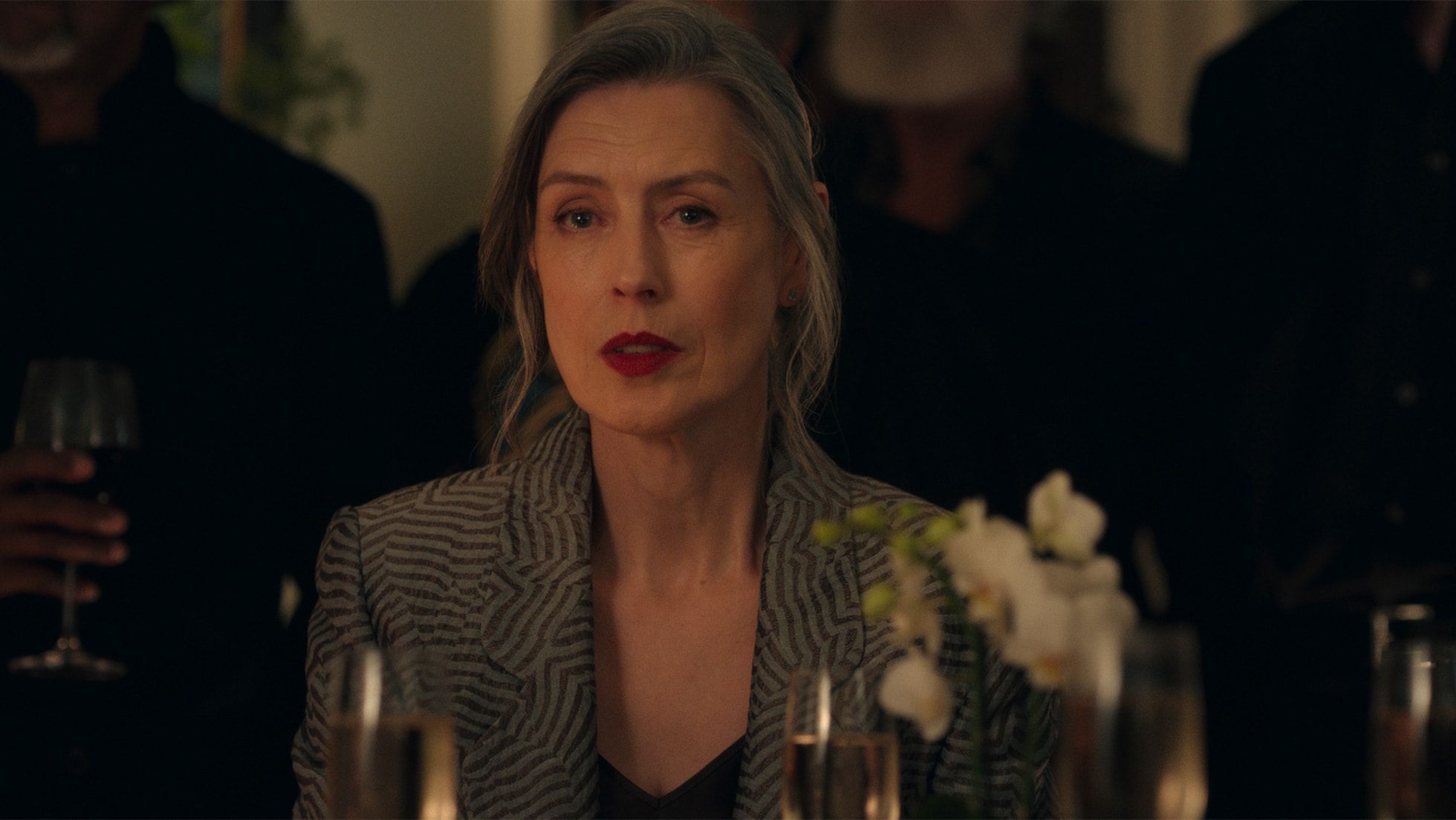 Gina McKee at a dinner table in The Wanted Man.