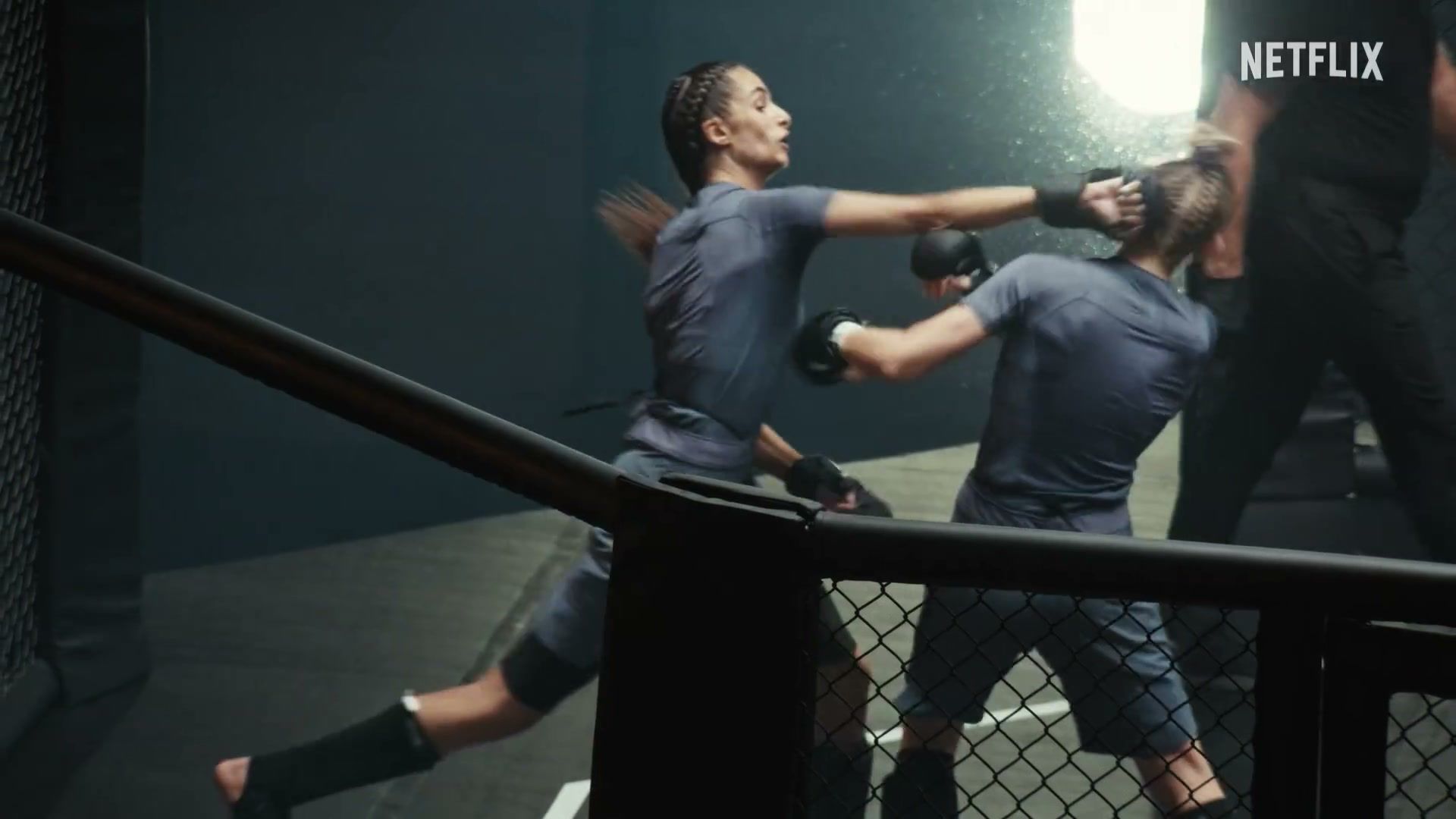 Two women compete inside the cage in the official trailer for L’Arène.