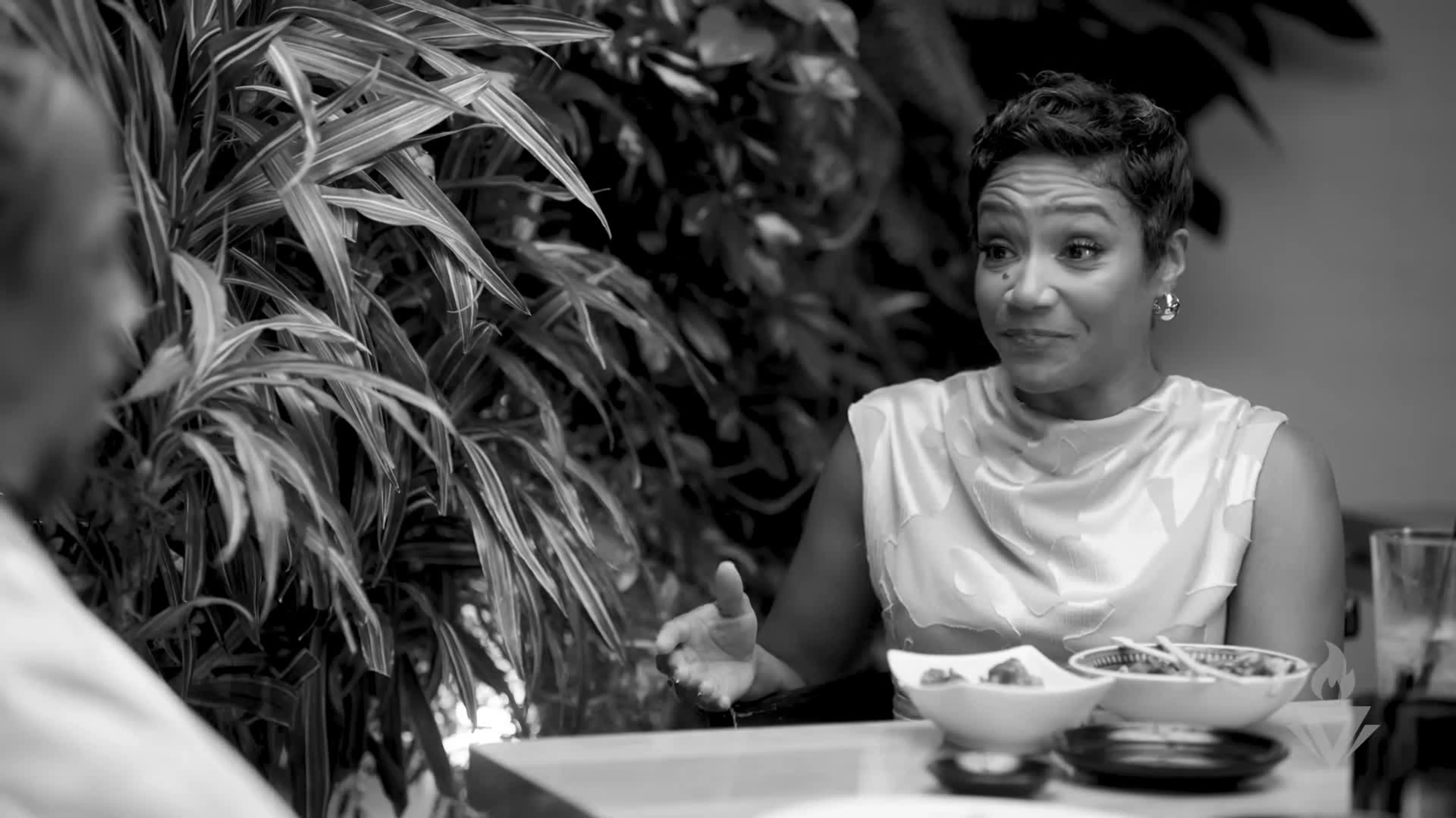 Tiffany Haddish speaks during a black-and-white moment in the Dinners With DeMar interview.