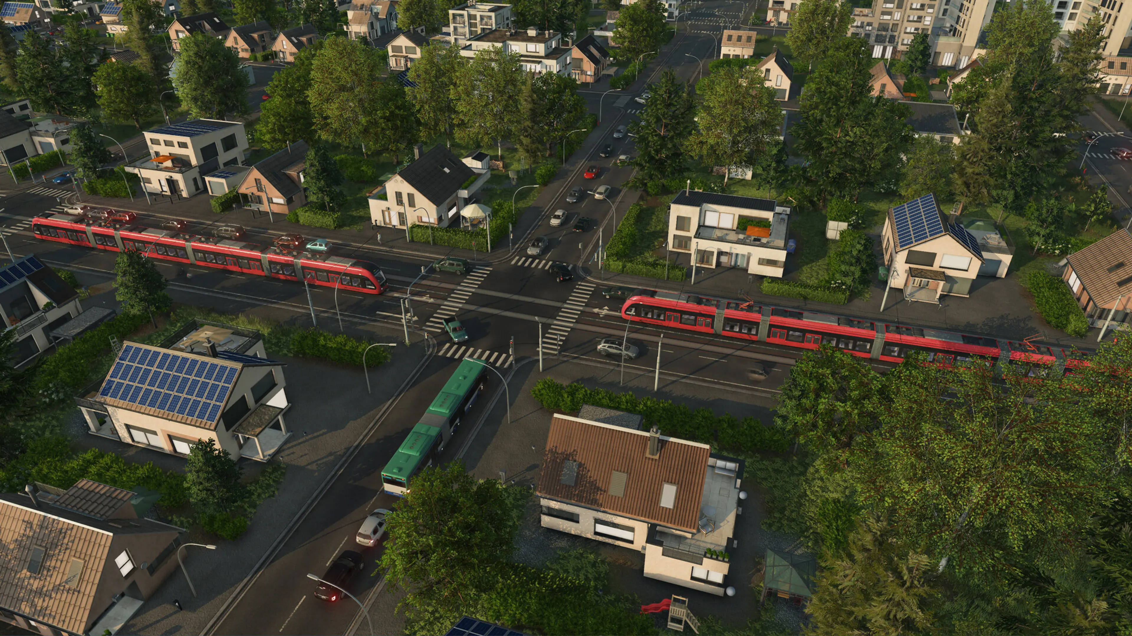 Red trams travel through a busy town in Transport Fever 3.
