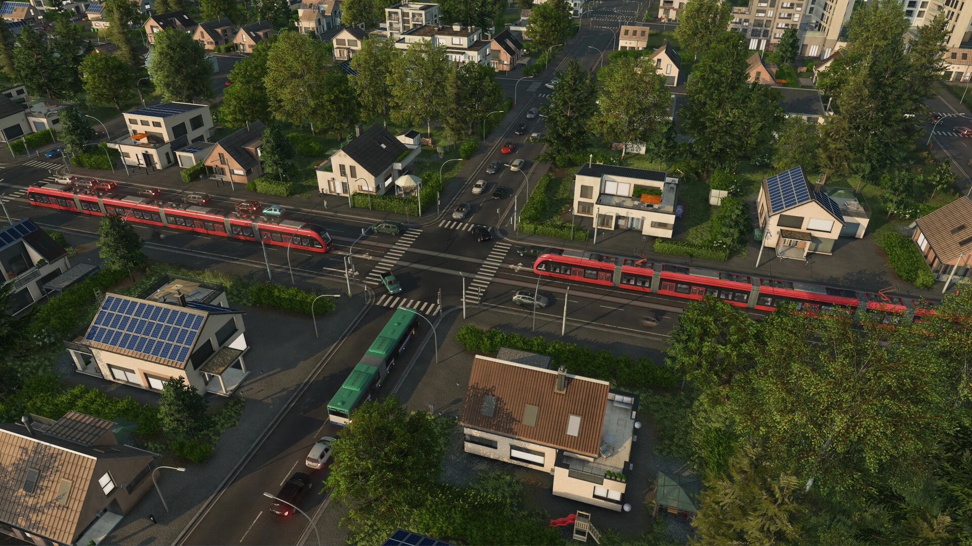 Red trams travel through a busy town in Transport Fever 3.