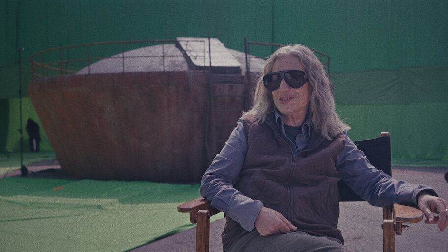 Mercedes Morán sits outside on the set of My Sad Dead.
