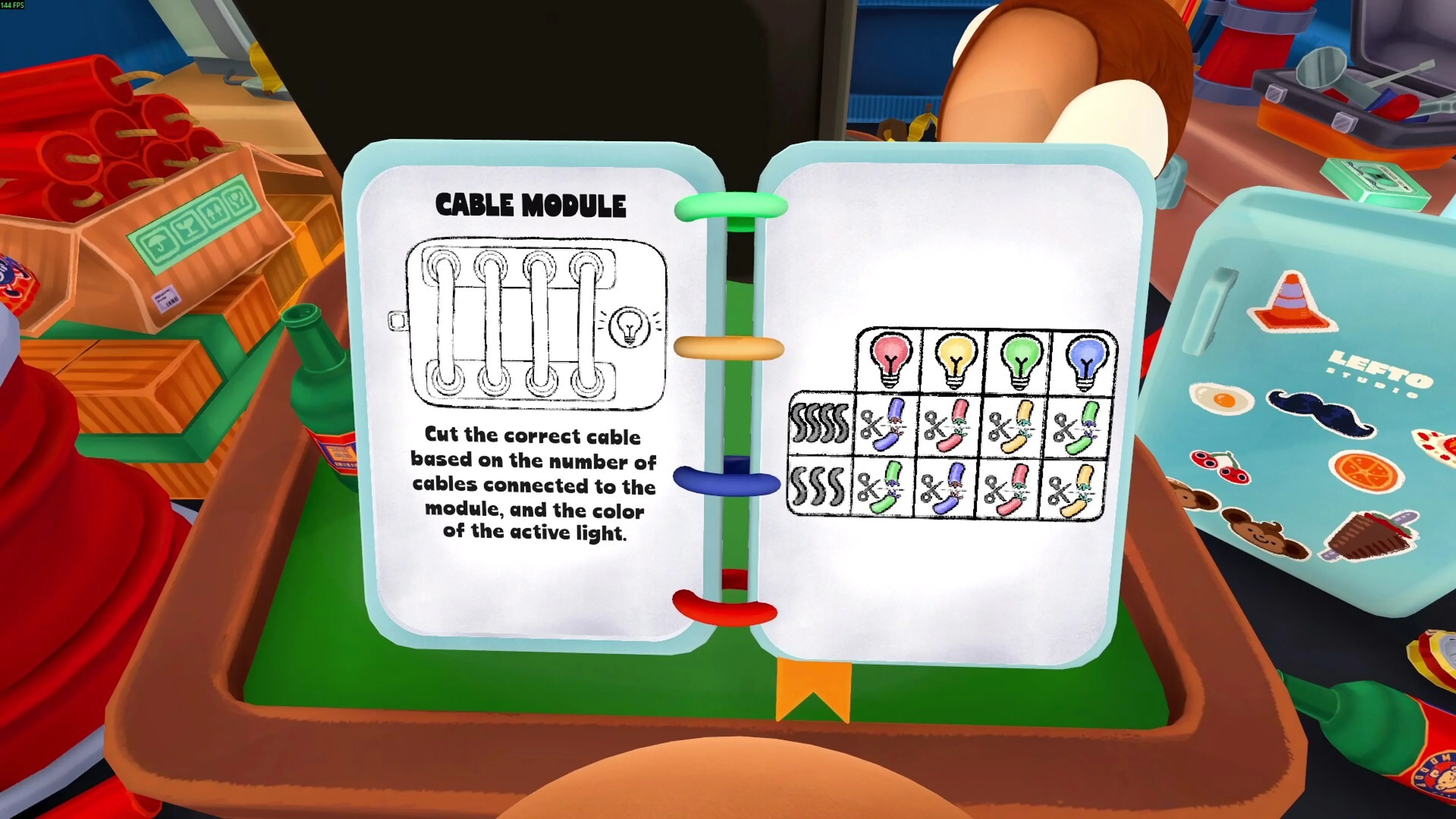 A BOMBANANA player compares the cable-module manual with the matching wires on the bomb.