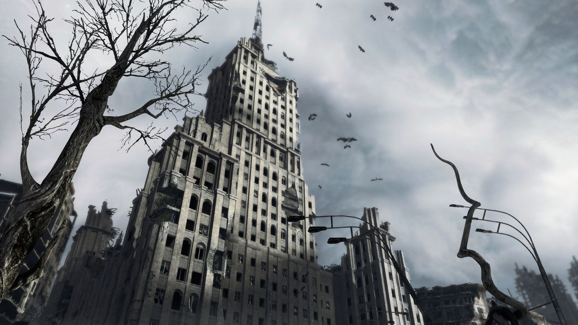 A damaged Moscow tower rises behind bare trees in Metro: Last Light Redux.