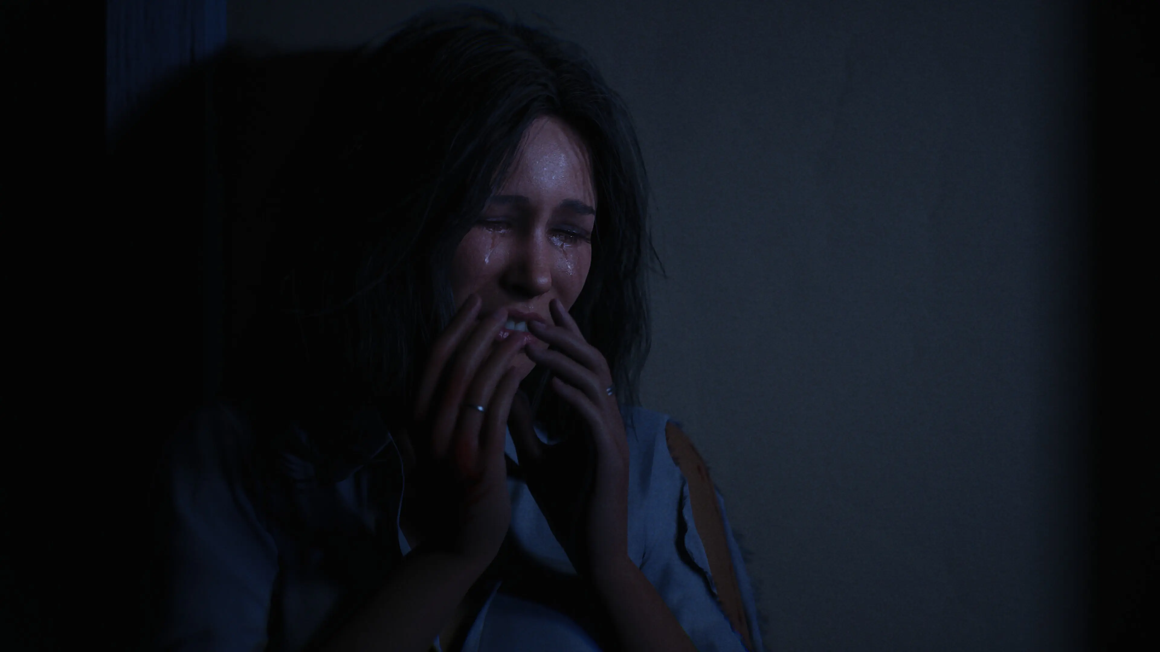 A frightened civilian covers her mouth in Halloween: The Game.