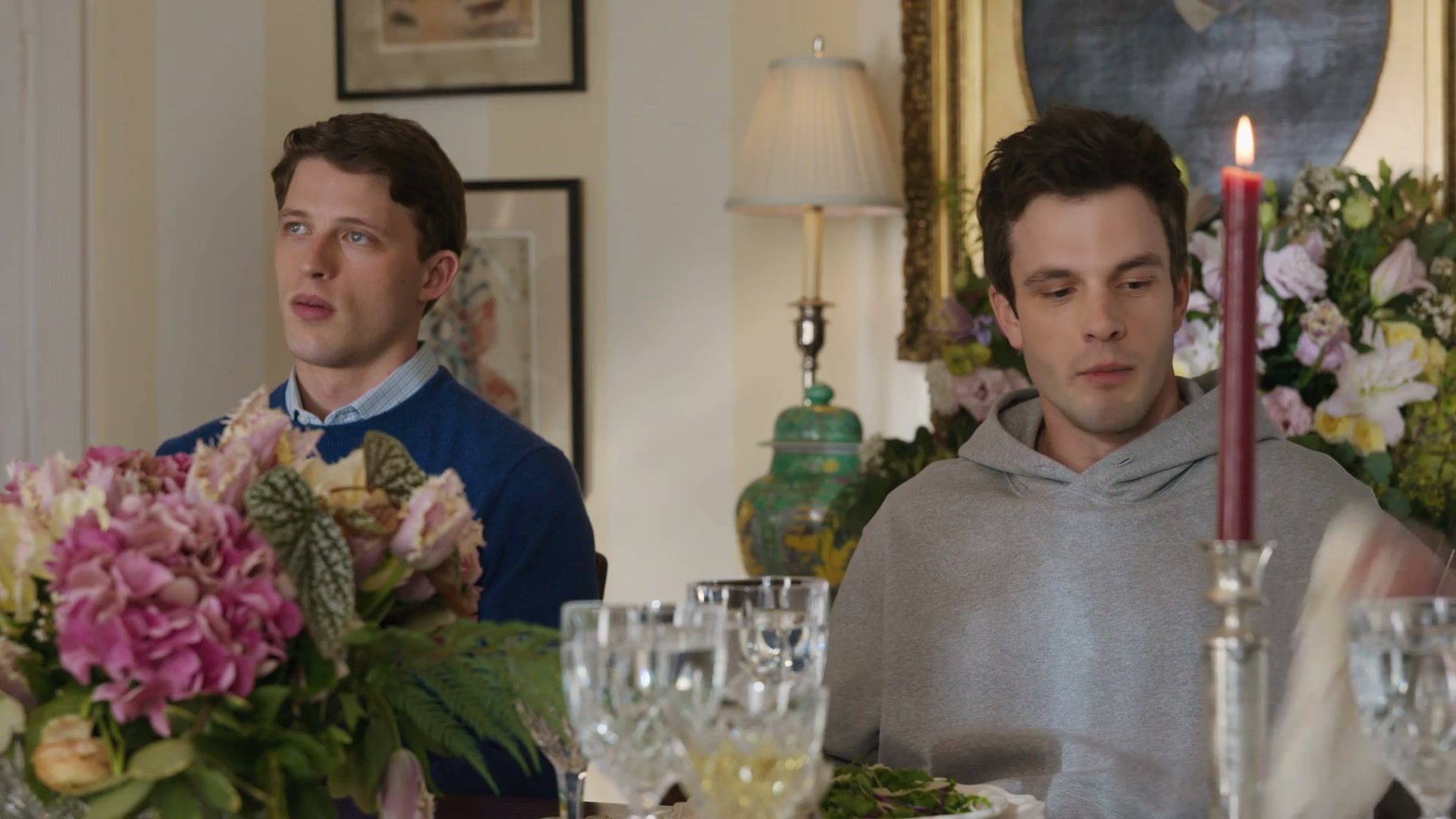 Two members of the Hollingsworth family sit across a dinner table in Line of Fire.