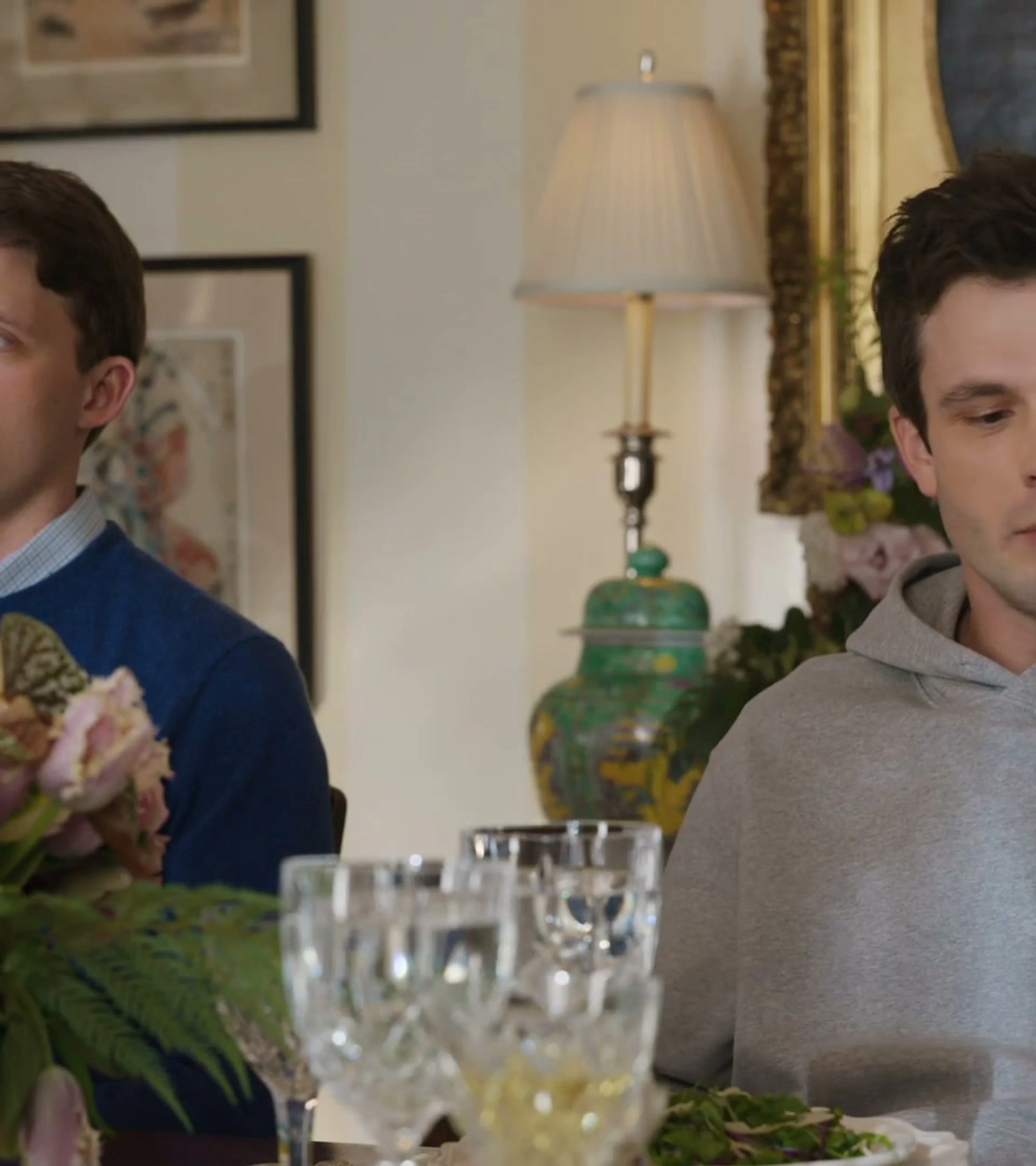 Two members of the Hollingsworth family sit across a dinner table in Line of Fire.