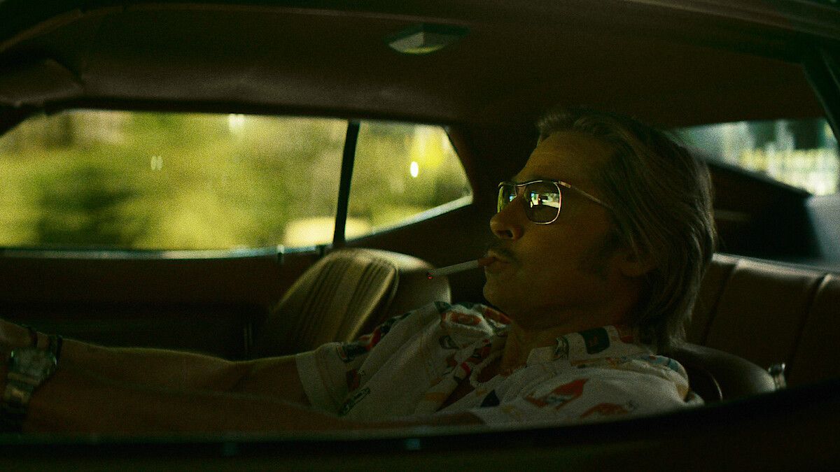 Brad Pitt as Cliff Booth drives through Los Angeles in 1977.