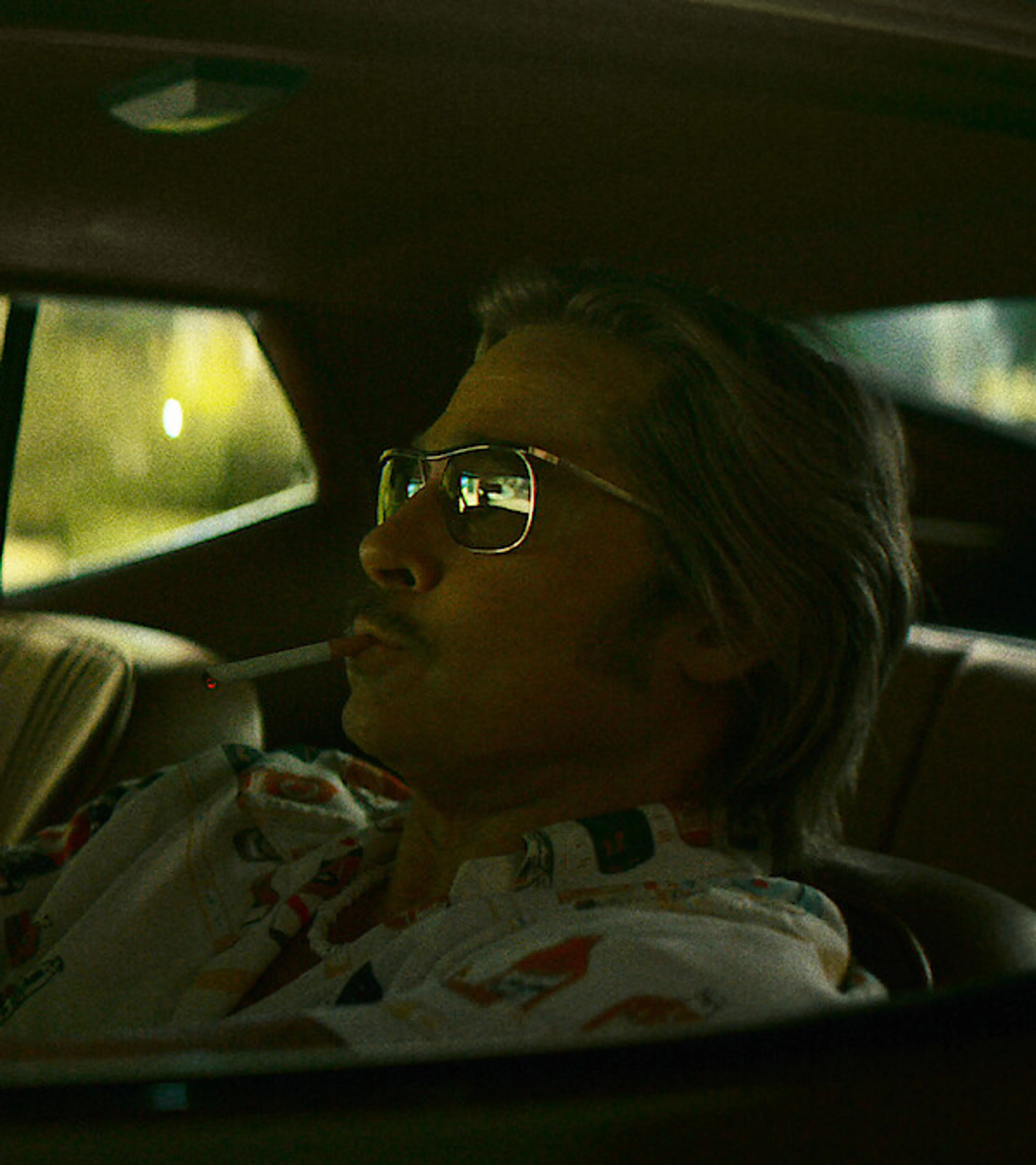 Brad Pitt as Cliff Booth drives through Los Angeles in 1977.