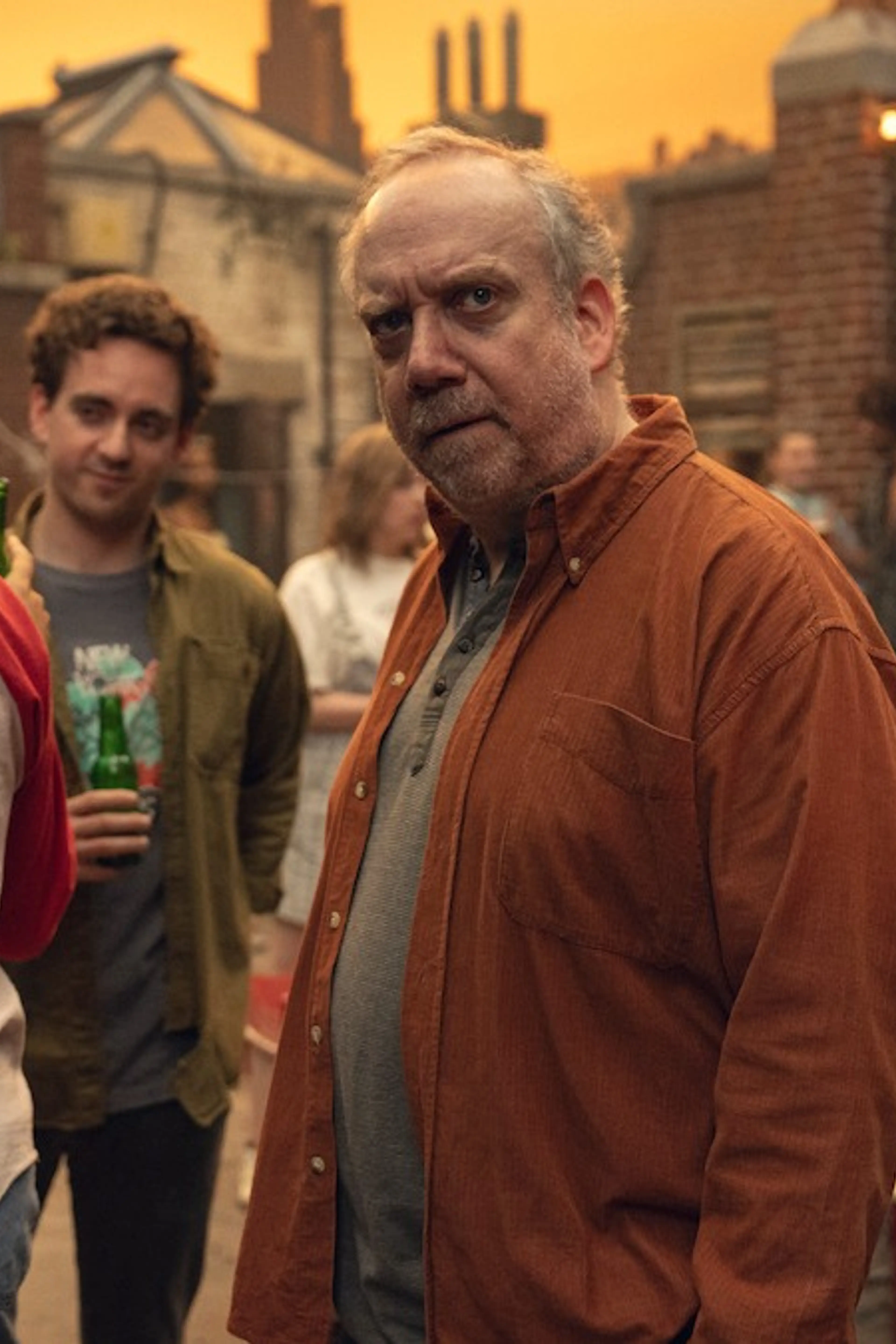 Paul Giamatti looks toward the camera in an official Black Mirror Season 7 still.