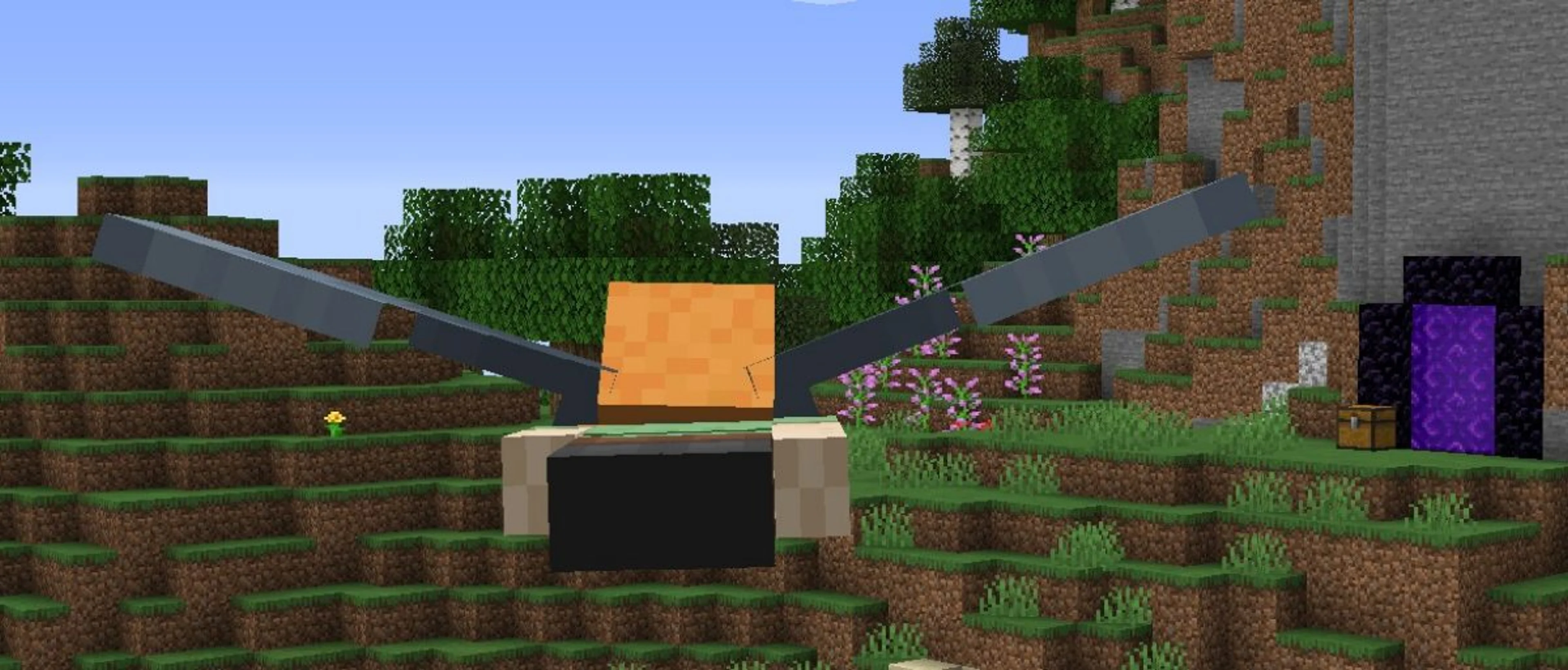 A Minecraft player gliding with an elytra over the Overworld near a Nether portal.