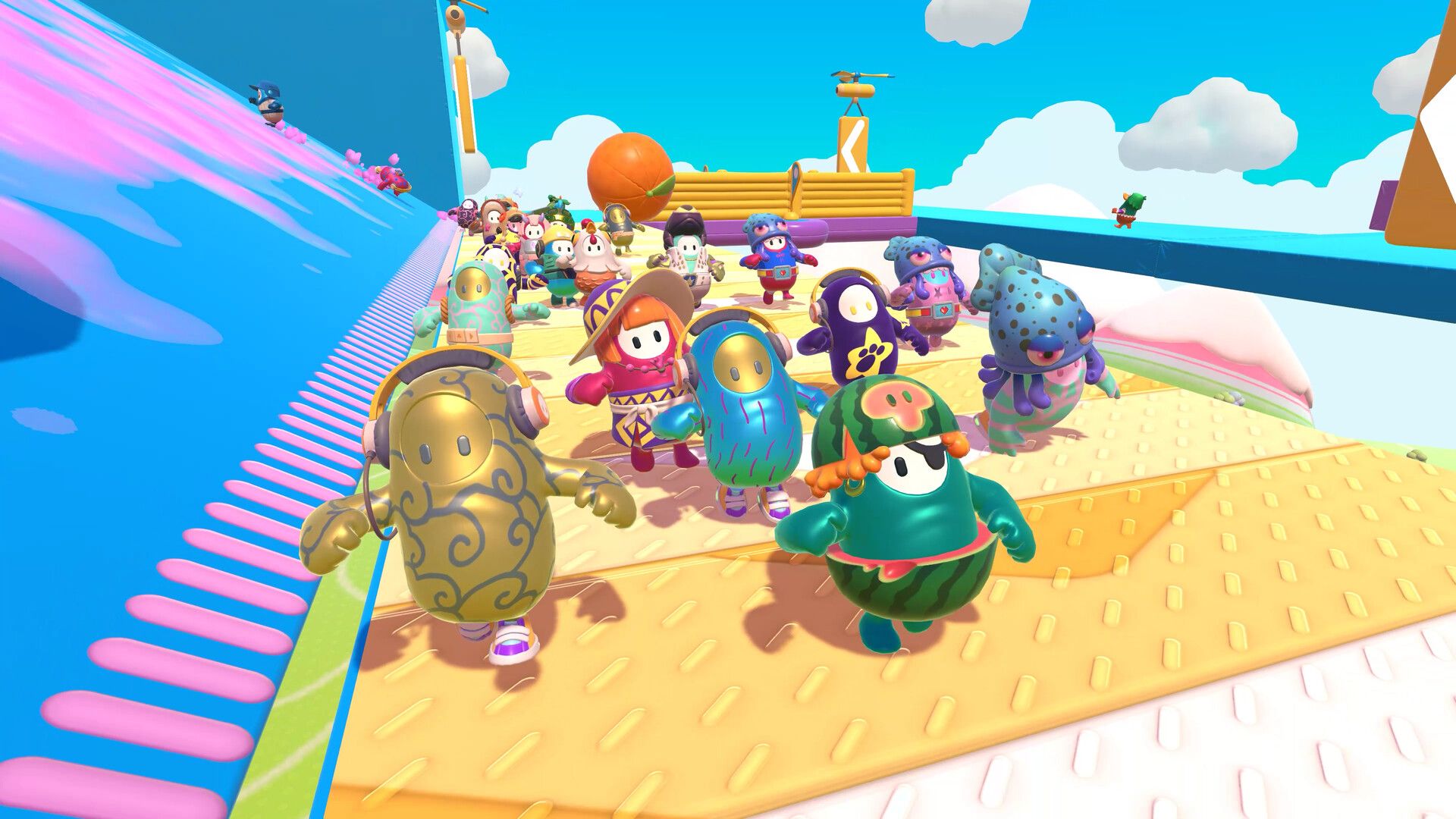 Many bean contestants stand near a bright obstacle-course start.