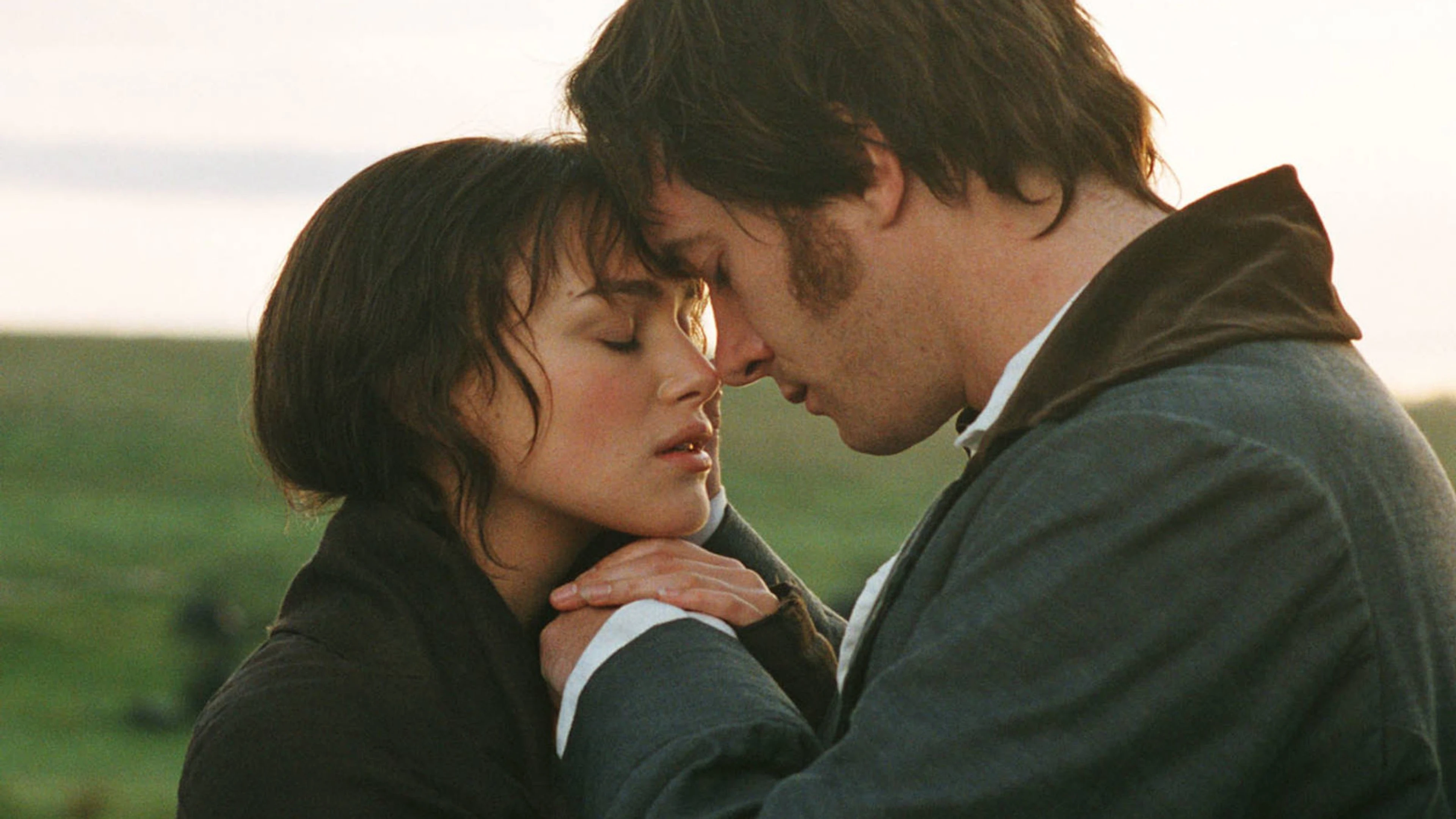 Elizabeth Bennet in the foreground with Mr. Darcy behind her.