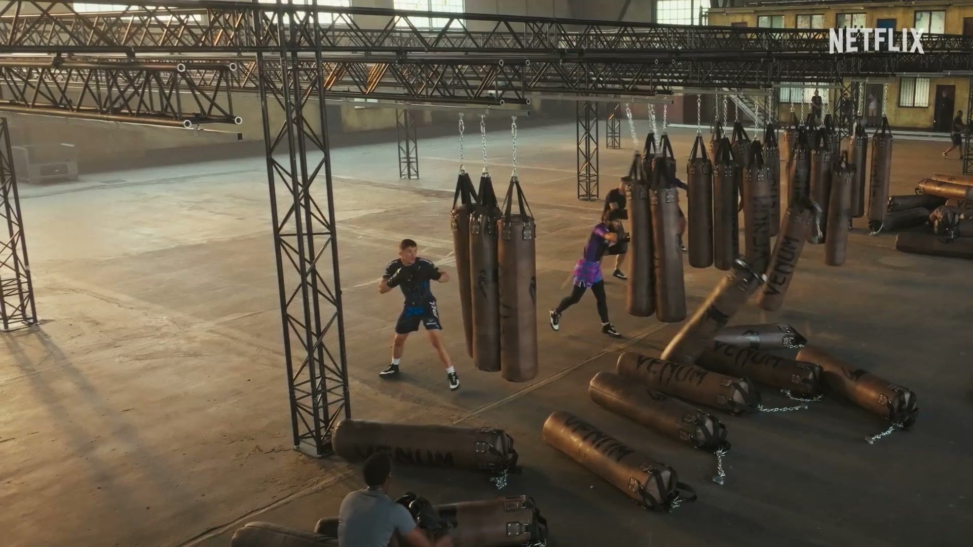 A competitor moves through an indoor conditioning course in the official trailer.