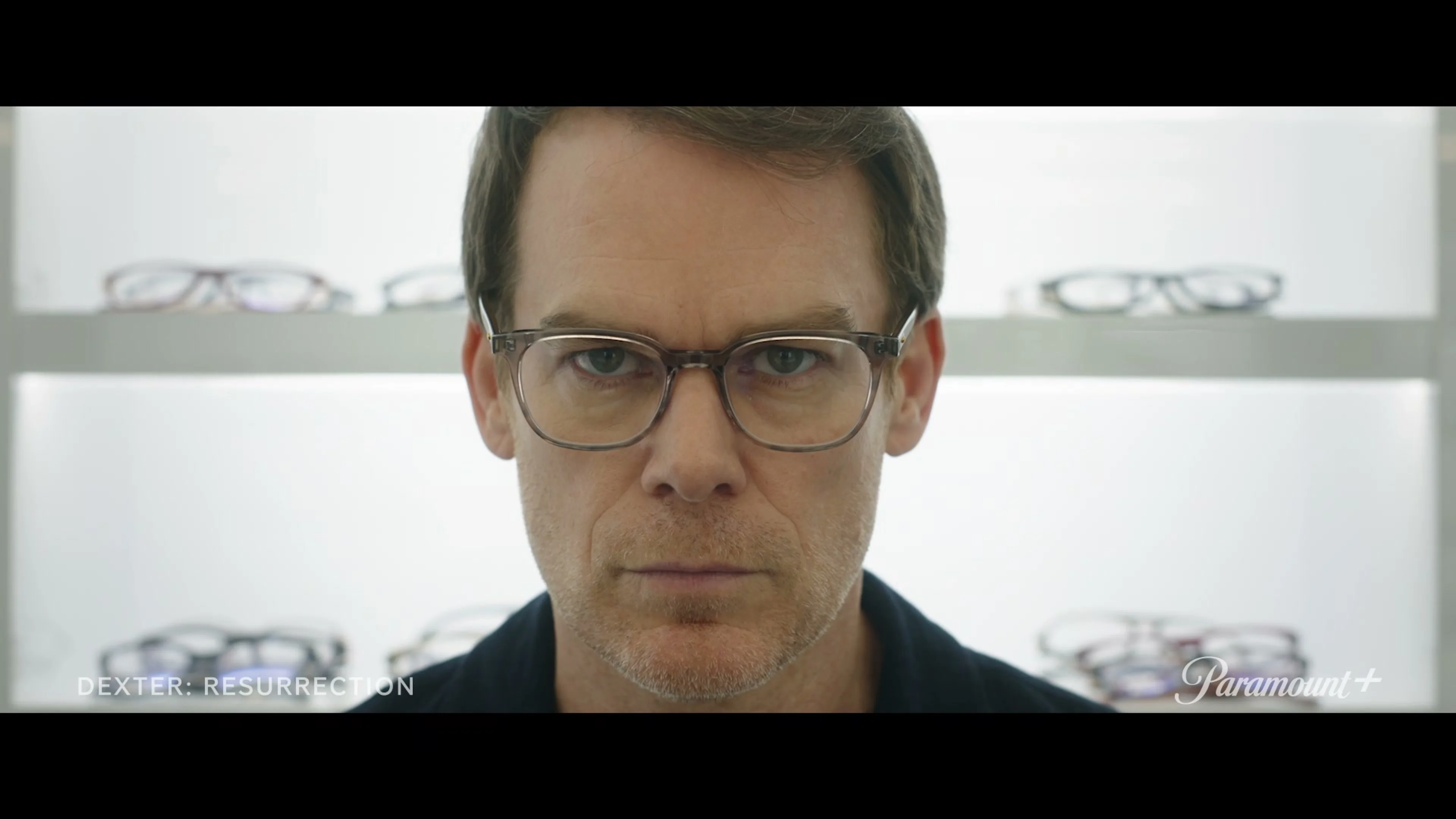 Michael C. Hall as Dexter Morgan faces the camera while wearing new glasses in the official Season 2 teaser.