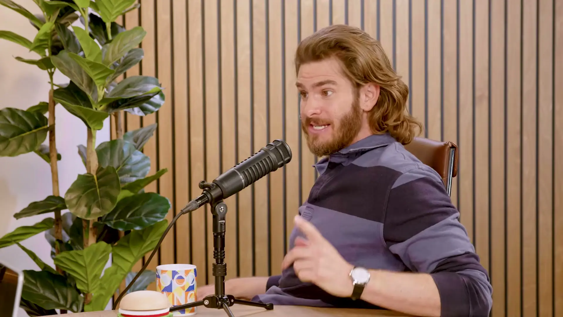 Andrew Garfield gestures while speaking on Good Hang with Amy Poehler.
