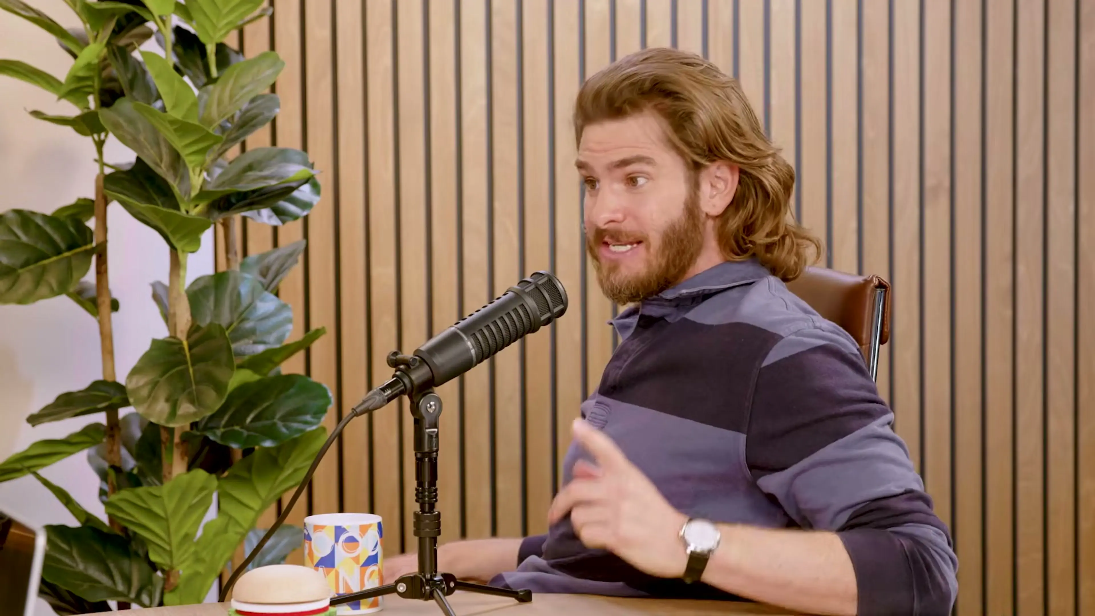 Andrew Garfield gestures while speaking on Good Hang with Amy Poehler.