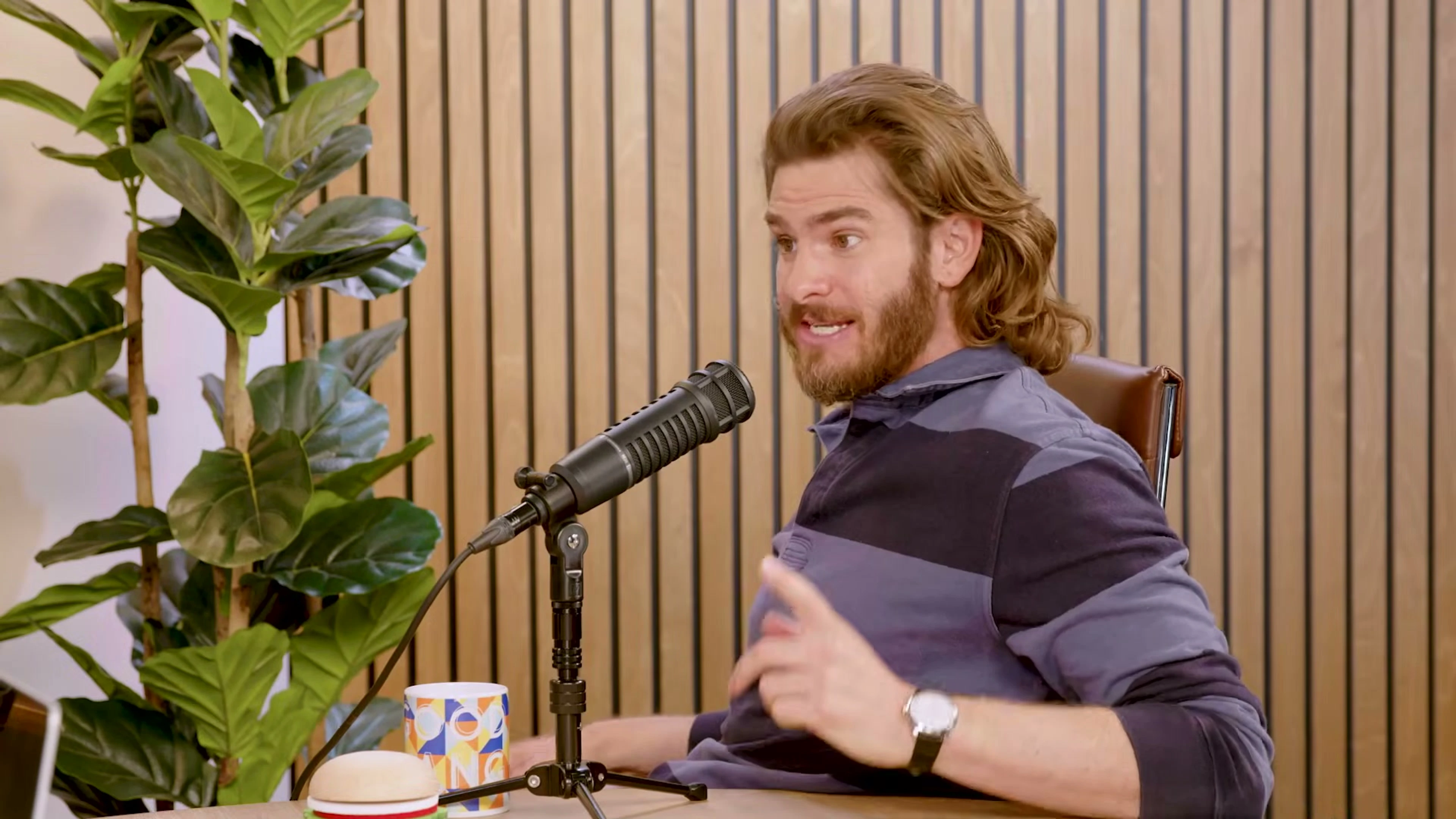 Andrew Garfield gestures while speaking on Good Hang with Amy Poehler.