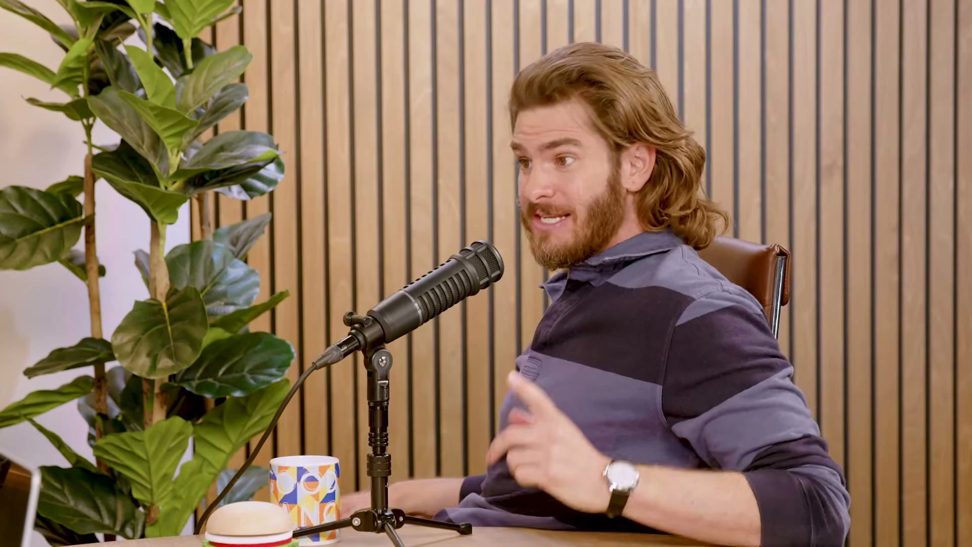 Andrew Garfield gestures while speaking on Good Hang with Amy Poehler.