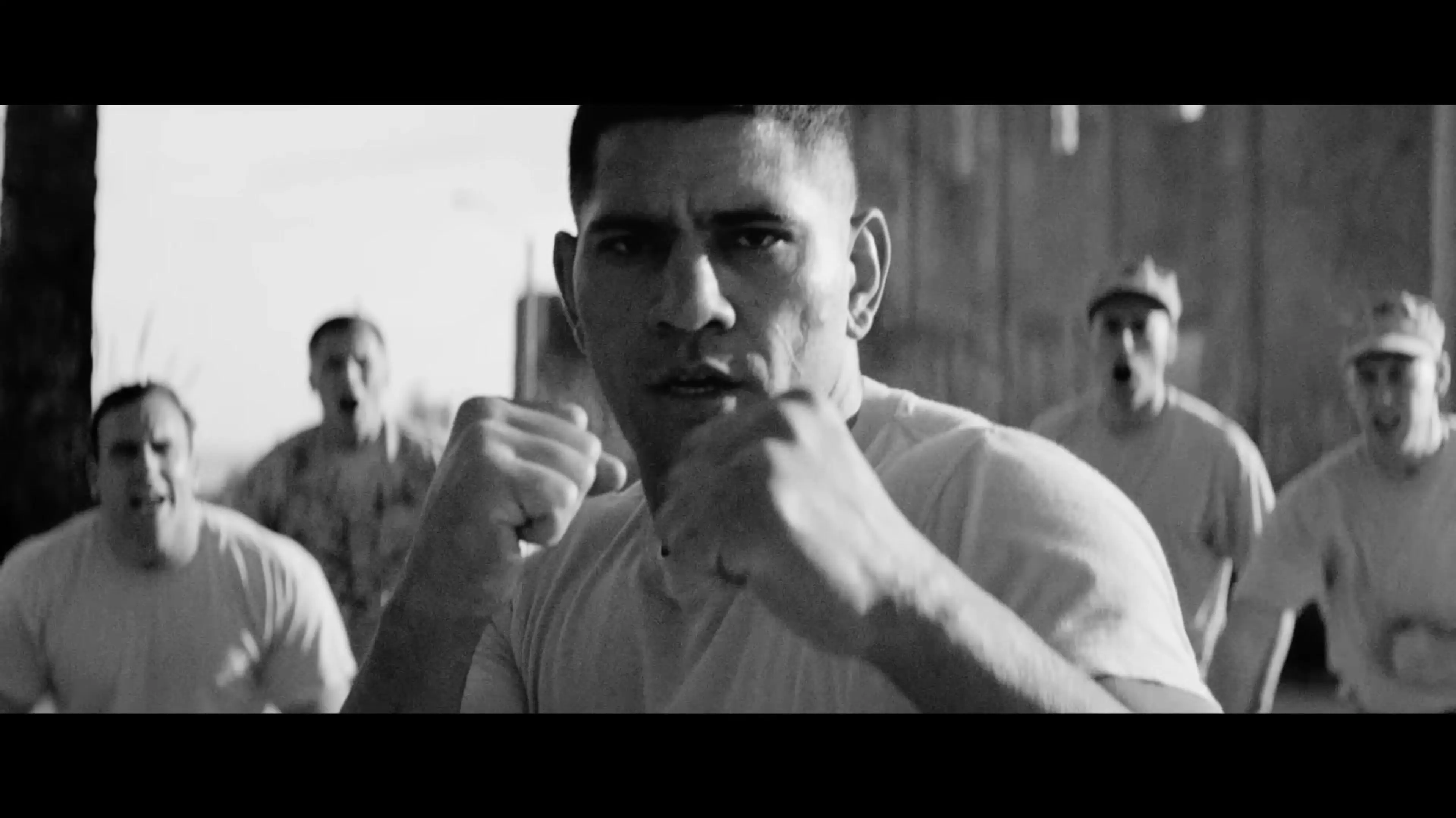 A soldier trains in a black-and-white flashback in Onslaught.