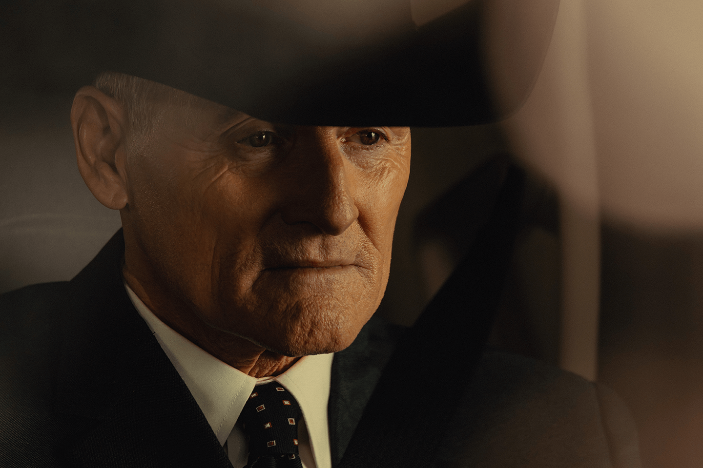 Colm Feore as Nathan, wearing a black hat in Landman.